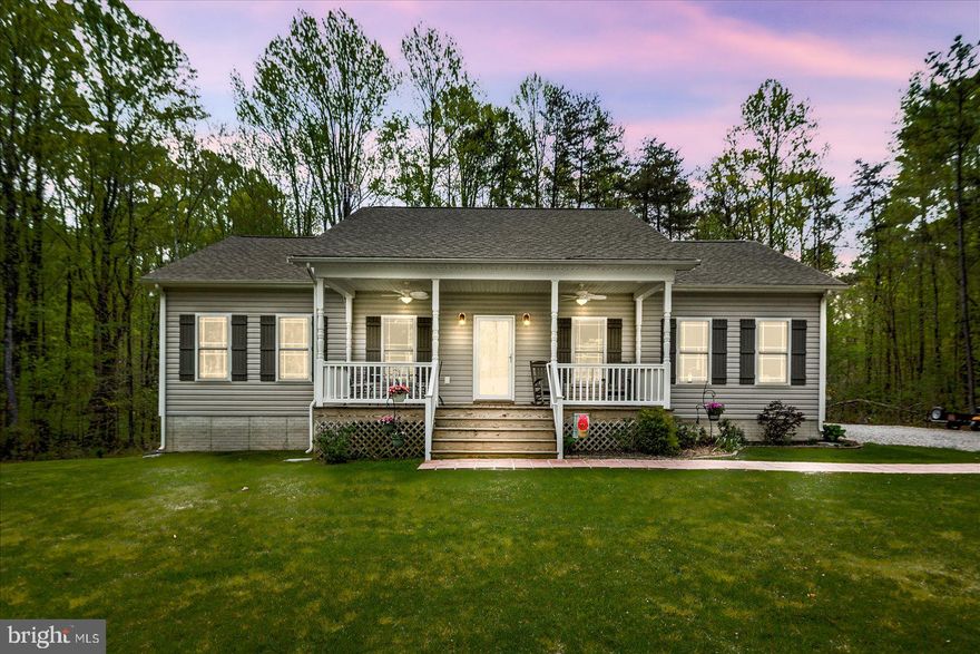 Country living on 10 acres, gorgeous newer home with so many extras!  The home features comfortable indoor and outdoor living!  Front porch sitting at its best with this 8' porch with ceiling fans and room for rockers and a table and chairs! Open eat-in kitchen and living room great you as you enter.  Large island with seating and space for your dining table. Wood burning fireplace to enhance your comfort on those cold nights centers the living area.  Primary bedroom with en suite and large (3' x 8') walk-in tiled shower to wash away your stress!  Two other bedrooms  and full bath flank the opposite side of the living room offering everyone more privacy.  The basement is waiting to be finished and is plumbed for another bathroom and walks out to the backyard.  Separate storage room that houses the water heater, and whole house water filter.   Equally as enchanting as the home is what all the outdoors offer!  A large screened in porch (16' x 16') to relax in is just off the kitchen with ceiling fan and a paver patio and storage area for your lawn care items below the porch.  There is a chicken coop and fenced in garden area for your own private mini farm!  The attached 2-car garage is side facing, making the curb appeal even better and there is ample parking for all of your guests in the spacious driveway!  Towards the back of the property sits a quonset hut that is 20' x 38' with workbench and 2 storage rooms to the side of the open area, all permitted with electricity and unlimited potential.  There is even a treehouse with electricity nearby plus another large cleared area of about 1-2 acres.