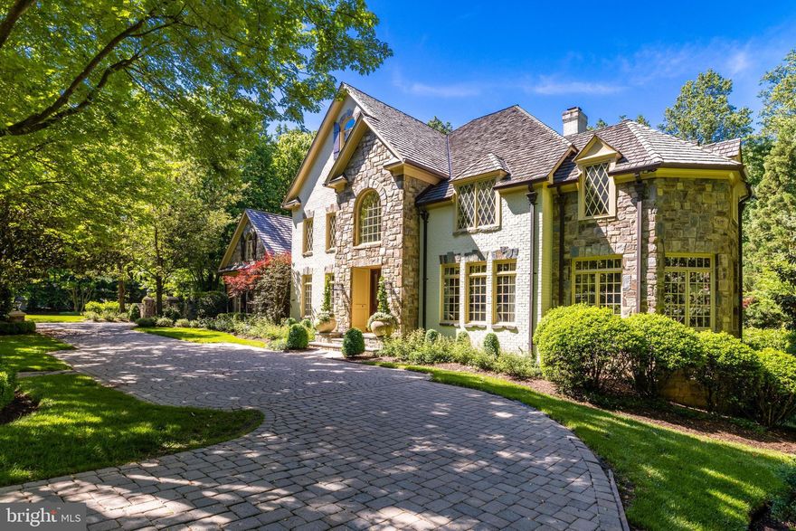 Introducing 10005 Windy Hollow Road, an extraordinary French estate in the exclusive Falcon Ridge neighborhood of Great Falls. Situated on 1.72 private acres, this impressive property offers professionally landscaped grounds, extensive hardscaping, and a dreamy pool/spa combo for the perfect indoor/outdoor lifestyle. The elegant interior features quality craftsmanship and finishes - stone fireplaces, hardwood floors, custom built-ins and extensive molding, trim, and millwork throughout. The floor plan is thoughtfully laid out for elevated living and offers flexible spaces for formal and casual gatherings alike. Work from home in the wood-paneled office, or relax in the sunroom with a double-sided gas fireplace. The gourmet eat-in kitchen features top-of-the-line appliances and a spacious butler's pantry, perfect for hosting dinner parties! The 2-story family room off the kitchen showcases a stunning Palladian window with ample natural sunlight. The main level is rounded out with a formal dining room, sitting room and two half baths. 4 generous bedrooms upstairs all feature en-suite baths and custom closet space. The primary bedroom includes a cozy gas fireplace, cedar closets and a spa-like bath with a soaking tub and separate vanities. The walk-out lower level includes all the amenities your family needs - enjoy a wet-bar with wine storage, a full gym, and home theater. The full 5th bedroom and bath are perfect to host out of town guests or to use as an in-law suite. The charming ivy-covered carriage house offers two additional garage spaces and a full living space upstairs. This studio apartment has been updated with fresh paint and new carpets, and includes a full bath, working kitchenette and built-ins. Incredible outdoor living with a built-in bbq on the deck, multiple trellises and impressive stone features. Enjoy summertime right here in your own backyard with a heated built-in pool and spa. A grassy side yard is perfect for lawn games, playtime and letting pets run free. Take advantage of the private and serene setting whilst enjoying a friendly neighborhood feel that Falcon Ridge has to offer. Located in the desirable Langley High School pyramid and minutes to Tysons Corner, I-495 and the GW Parkway, this is true lifestyle property in the heart of Great Falls. Welcome home!