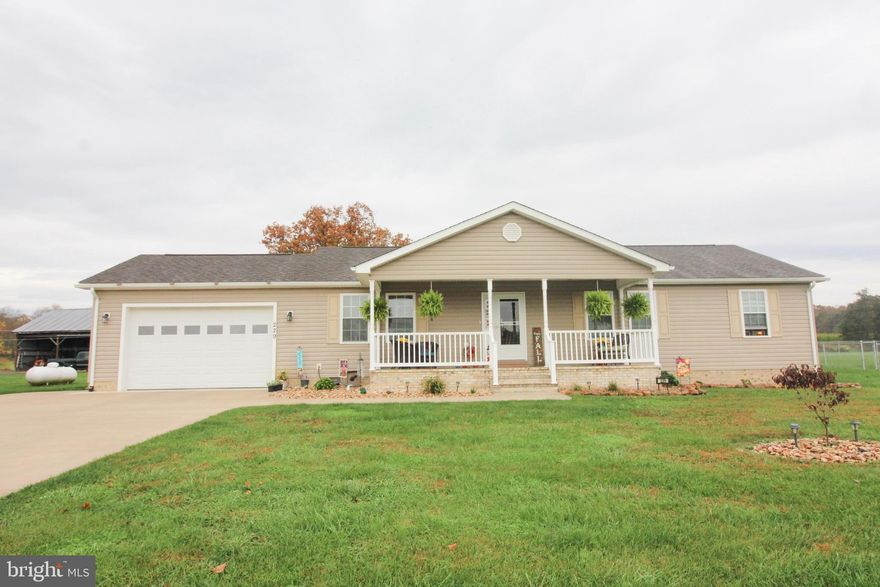 Welcome Home! Gorgeous Rancher in the Country with an Open Floor Plan!! Just built in 2019  this immaculate home has a 2 Car Attached Garage, Nice Deck with New  patio! You will feel right at home as soon as you open the door and see how pristine this home is! Spacious kitchen that has tile flooring, plenty of counter space and stainless steel appliances, Dining Room leads out to back Deck and Patio, Bedrooms have plenty of room and closet space, Master Suite is perfect for a King Sized Bed! I absolutely love the front porch and looking at those views!!! Call to view!!