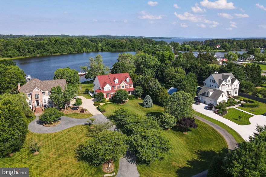 BRAND NEW PRICE! Magnificent 6,000+ sq.ft. custom waterfront property on Island Creek highlighted by a pool and a deep-water pier with multiple slips & lifts.  The main level of the residence features a dramatic two-story great room with stone fireplace, gourmet chef’s kitchen with breakfast area, dining room, formal living room, office, 2-story foyer, laundry, powder room, screened porch, and rear deck.  The second level offers a generous primary suite bathed in sunlight with walk-in closet, 2 additional closets, and a large primary bathroom with separate vanities, separate shower and a soaking tub.  3 additional bedrooms and a full bath complete the 2nd level.  The 3rd level has the 5th bedroom, 3rd full bath, and attic access for storage.  A finished lower level with walk-out stairs offers recreation room, TV area with wet bar, wine closet for 700 bottles, the 4th full bathroom, and a the utility room used as workshop with ample storage and a sink.  The residence is completed by a front porch that wraps around along the side and connects to the screened porch at rear.  The rear yard with heated pool is an entertainers dream with plenty of space to play.  Storage shed with electric, two-car garage, extensive irrigation system, 120' of water frontage, geothermal heating & cooling,  pier with 3 slips, 15,000 lb. lift, 3000 lb. lift, 3 jet ski lifts, 8’ MLW are some of the many highlights that make this offering a must see!  Easy access to Patuxent River & Chesapeake Bay and located just 45 miles from D.C. and Northern Virginia.