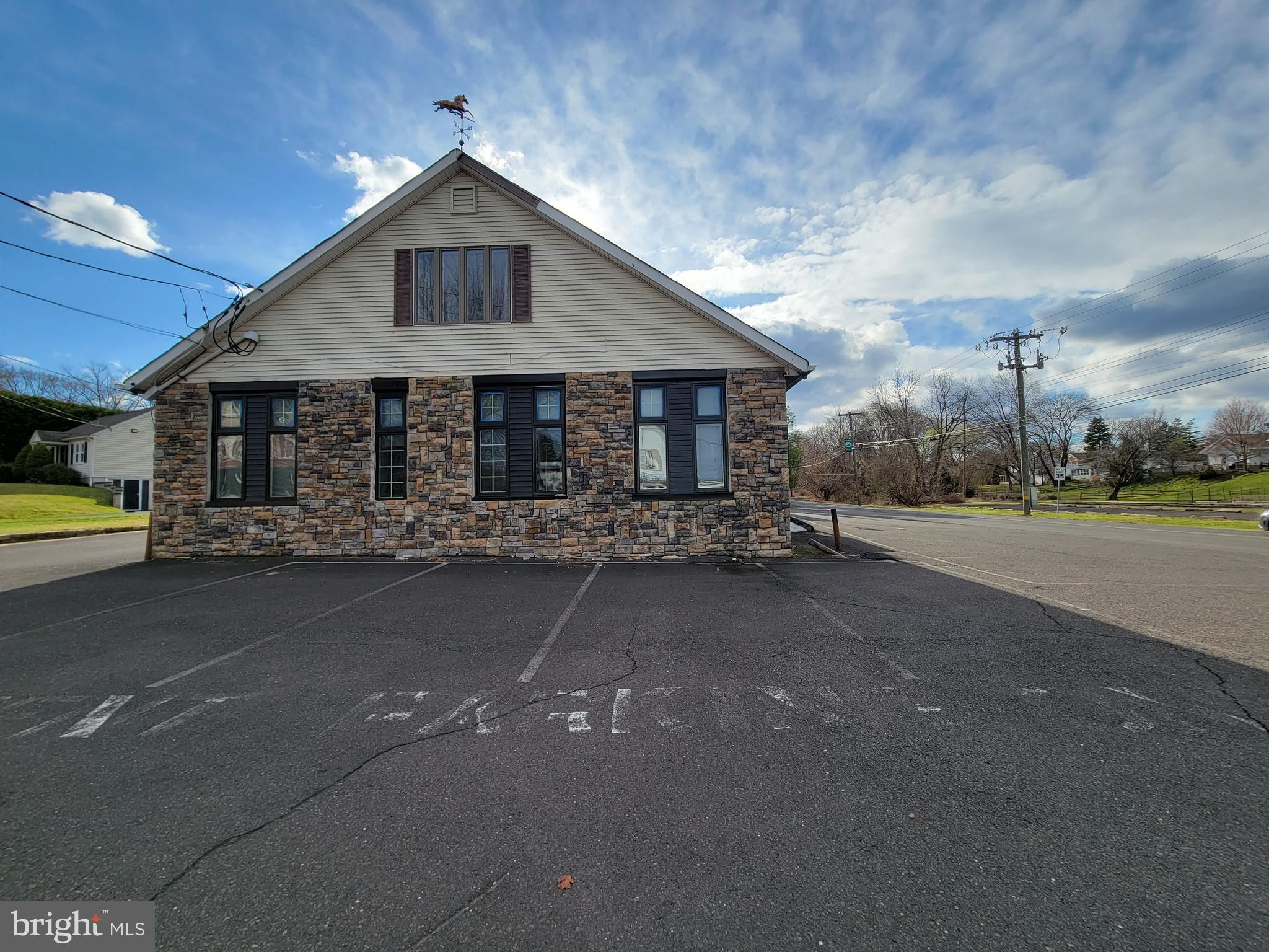 Versatile Commercial Opportunity with Residential Apartment! This spacious freestanding building offers appx. 3,480 sq. ft. on the first floor—ideal for medical, wellness, or professional office use. Previously operated as a chiropractic office, the space is ready to be tailored to suit your business needs and offers great flexibility for a variety of commercial uses. The property features ample on-site parking, ensuring easy access and convenience for both staff and clients. Upstairs, appx. 1200 sq. ft. the second-floor apartment includes 2 bedrooms, 1 full bathroom, a large eat-in kitchen, a spacious living room and dining area, and a laundry closet with washer and dryer. Please note: 2nd floor is rented and the balcony is for emergency escape only. Located in the desirable Council Rock School District, this property presents an excellent opportunity for both owner-occupants and investors. Important: Prospective buyers are encouraged to contact Northampton Township to verify permitted uses for the property.