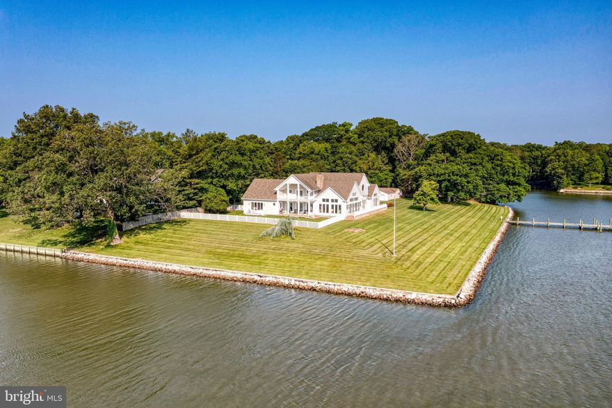 Experience waterfront living at its finest with this impeccably crafted custom retreat nestled along the picturesque Wye River. Offering a remarkable 700 feet of riprapped shoreline and a coveted southeast exposure, this remarkable property is truly a rare gem in today's market. Situated on a stunning corner point of land, this Craftsman style home was thoughtfully designed in 2012 to maximize breathtaking views from every angle, making it an ideal year-round residence or weekend getaway.

Spanning over 7,700 square feet, this extraordinary home boasts an open floor plan with lofty 10-foot ceilings throughout. The main level features a luxurious Owner's Bedroom and Living Room Suite complete with a cozy gas fireplace and built-in shelving. Additionally, there is a convenient main level Bedroom Suite perfectly suited for guests, in-laws, or an au pair, featuring delicately incorporated handicap-accessible features. Ascending either of the two staircases, you will discover two more spacious en-suite bedrooms on the upper level, all offering captivating vistas.

The heart of this residence lies in its stunning Chef's Kitchen, meticulously designed for both functionality and entertainment. Gather around the expansive center island featuring exquisite black Morgan granite and seating for 8-10 guests. The kitchen is equipped with top-of-the-line appliances, including a 6-burner gas range, wall oven, built-in microwave, 2 refrigerators, 2 dishwashers, and 2 sink areas. Adjacent to the kitchen, two grand Great Room areas are separated by an impressive floor-to-ceiling stack stone wood-burning fireplace, creating an inviting atmosphere for relaxation and conversation.

No detail has been overlooked in this remarkable home. The main level also boasts a two-story formal Dining Room, providing captivating water views for memorable meals. Step outside onto the side patio, perfect for alfresco dining, and take in the tranquility of the waterfront setting. Gorgeous random width, natural white oak hardwood floors grace the interior, and a two-car attached garage, along with a driveway accommodating 10+ cars, ensures ample parking for residents and guests. For the avid car enthusiast or hobbyist, a separate four-car detached garage/workshop adds even more appeal.

This waterfront oasis is ideally located just off Bennett Point Road in Queenstown, offering easy access to both Annapolis and Easton, both mere 30-minute drives away. Rest easy knowing that this property boasts a high elevation and is situated outside of any flood zones. Water depth is 6 ft MLW (buyer to verify). 

Indulge in the ultimate waterfront lifestyle and seize this incredible opportunity to own a truly exceptional property that effortlessly blends style, comfort, and captivating natural beauty.