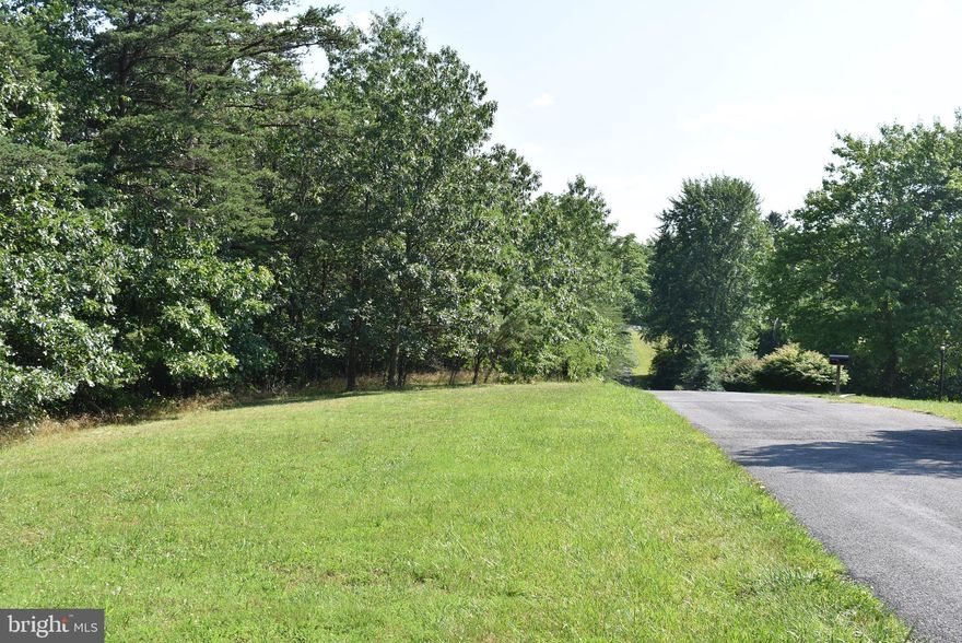 CHECK OUT THIS 5.369 AC+- LOT IN  SPRING VALLEY SUBDIVISION. THE PROPERTY IS  LOCATED AT THE END OF THE STREET SO THERE WOULD BE VERY LITTLE TRAFFIC.. THE PROPERTY IS  JUST A FEW MILES FROM DOWNTOWN BERKELEY SPRINGS WITH IT'S ANTIQUE STORES, QUAINT SHOPS & GREAT RESTAURANTS. THE PROPERTY IS MOSTLY WOODED BUT HAS A LARGE CLEARING  WITH HARD ROAD FRONTAGE THAT WOULD BE A IDEAL LOCATION TO BUILD A NEW HOME. THE PROPERTY HAS BEEN PERCED APPROVED.. VERY PRIVATE, YET CLOSE TO ALL THE CONVENIENCES. ABOUT AN HOUR & A HALF FROM WASHINGTON DC & BALTIMORE & WOULD MAKE A GREAT LOCATION FOR A SECOND HOME TO GET AWAY FROM ALL THE HUSTLE & BUSTLE.