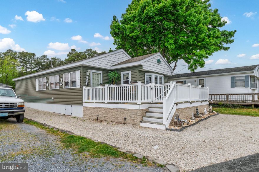 Welcome to easy coastal living with this charming 2-bedroom, 1.5-bath home offering peaceful water views and a quiet, tucked-away setting.

Step outside to a beautiful deck—perfect for morning coffee, evening unwinding, or entertaining while enjoying the tranquil waterview backdrop. Inside, the home features a comfortable layout with great natural light and functional living spaces.

A unique bonus is the roof pitch, offering the potential to raise ceilings for added volume and a more open feel—an exciting opportunity to customize and add value over time.

Located in a the White House Beach community, this property presents an affordable path to coastal living without sacrificing lifestyle. Whether you’re looking for a full-time residence, weekend getaway, or investment opportunity, this home checks all the boxes.

Lot lease is 791.67 Contingent on Park approval