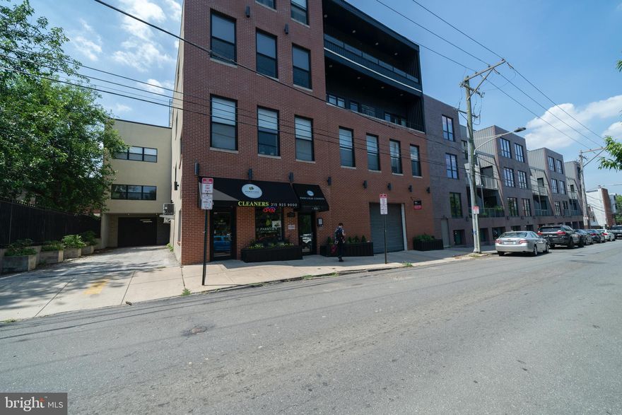 Welcome to PARKVIEW CONDOMINIUMS. This 4 story building is in a superior walkable location in Northern Liberties, located directly across the street from Liberty Lands Park and dog park right next door which is great for this pet friendly building! Walk to the Piazza and many nearby restaurants, cafes, pubs, coffee shops, boutiques, and fitness centers. Modern loft apartment with soaring ceilings, open floor plan, modern kitchen with stainless appliances and granite counter tops. Beautiful hardwood floors. Kitchen opens to dining area and family room. Huge windows bring in lots of natural light. Condo also features powder room and main bedroom with ensuite bath.  Note that the living area and kitchen photographs are from a previously staged listing in the building.  Building also features a roof top deck with 365 degree views of the city skyline and Ben Franklin Bridge. Condo includes garage parking with one deeded parking space.  Elevator access to each floor. Pet friendly building! Beautiful condo ready for immediate sale. Move right into easy living at Parkview Condominiums. Last unit for sale in the building!  Don't miss this incredible opportunity!
