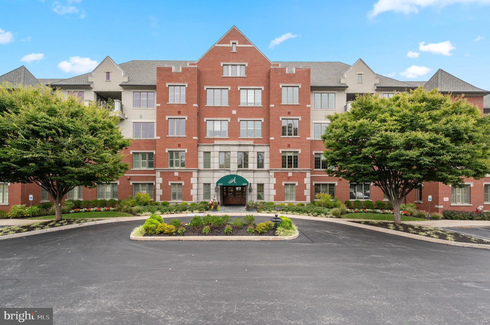 Welcome to Athertyn! This 2BR + Den, 2.5 Bath corner residence offers light-filled one-floor living with a private terrace overlooking the peaceful parkside setting of Haverford Reserve. From the moment you enter, you are welcomed by signature Pohlig craftsmanship, including double arched cased openings, wainscoting, crown molding, and finely detailed millwork carried throughout. The main living areas are enhanced by hardwood floors and a custom, floor-to-ceiling fireplace that serves as an inviting yet refined focal point. The gourmet Kountry Kraft kitchen, paired with a bright and airy morning room, is both beautifully appointed and highly functional—ideal for everyday living as well as entertaining. Offering 2 bedrooms, 2.5 baths, and a full-sized laundry room, this home balances comfort with convenience. The primary suite provides a serene retreat with generous walk-in closets and a spa-inspired bath featuring natural light, an oversized shower, and a soaking tub. A private den with custom built-ins adds versatility as a study, library, or home office. At Athertyn at Haverford Reserve, residents enjoy the ease of low-maintenance living within a 209-acre community designed around preservation and natural beauty. Miles of walking and biking trails weave through the landscape, while exclusive amenities include a clubhouse, pool and spa, tennis court, putting green, and gardens. Combining timeless architectural detail with the comfort and ease of single-level living, this residence offers a refined lifestyle in the heart of the Main Line.