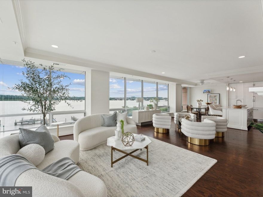 Incredible price improvement.   Prepare to be awestruck as you enter this one-of-a-kind penthouse with stunning views from every room. Perched above the Potomac in the heart of historic Old Town, unit 501  is one of just 18 residential units in the highly coveted Watermark.  The home features 2800 square feet of absolute perfection with upgrades throughout.  The open living room welcomes you with floor to ceiling windows offering views of the Old Town waterfront, National Harbor, and Washington DC. Enjoy cool nights by the fireplace with elegant tile surround, handcrafted mantle and custom built-ins.   Watch boats sail by while preparing meals in the open kitchen with Italian cabinetry, quartz countertops, custom tile backsplash and high-end appliances.  For casual dining, pull a stool up to the kitchen island or set the table and enjoy the sights outside.  For more formal affairs, retreat to the sophisticated dining room overlooking Old Town and the Potomac.  
The spacious primary suite is the ultimate retreat with a spa-inspired bathroom, extra large walk-in closet, and separate dressing area. Wake up to beautiful views, get in a workout, indulge in a luxurious bath, reinvigorate with a steam, and fall asleep knowing you get to do it all again tomorrow. The second en-suite bedroom features a custom walk-in closet, full bathroom, views of the Potomac, and patio access. Your guests may not want to leave. Enjoy more views from the third bedroom, currently set up as a home office. Features include pocket doors with frosted glass, a wall of custom built-ins, custom closets, and patio access. For seasonal items, there’s a private storage closet just outside the door.  Other highlights of unit 501 include nine foot ceilings, wide plank hardwood floors, custom wainscoting and crown molding, upgraded doors, upgraded tile, water treatment system, automated audio/video in every room, and fresh paint throughout. 

Building amenities include a rooftop terrace with two grills and a fire pit, an elegant lobby, fob-required elevator access, and bike storage. Included with this unit are two side-by-side garage parking spaces.  Located in the heart of historic Old Town you’re just steps from all the action -  shopping, dining, biking, running. Everything you could imagine is just outside your door.

The low condo fees make this an even more exciting offering. Your new home awaits.