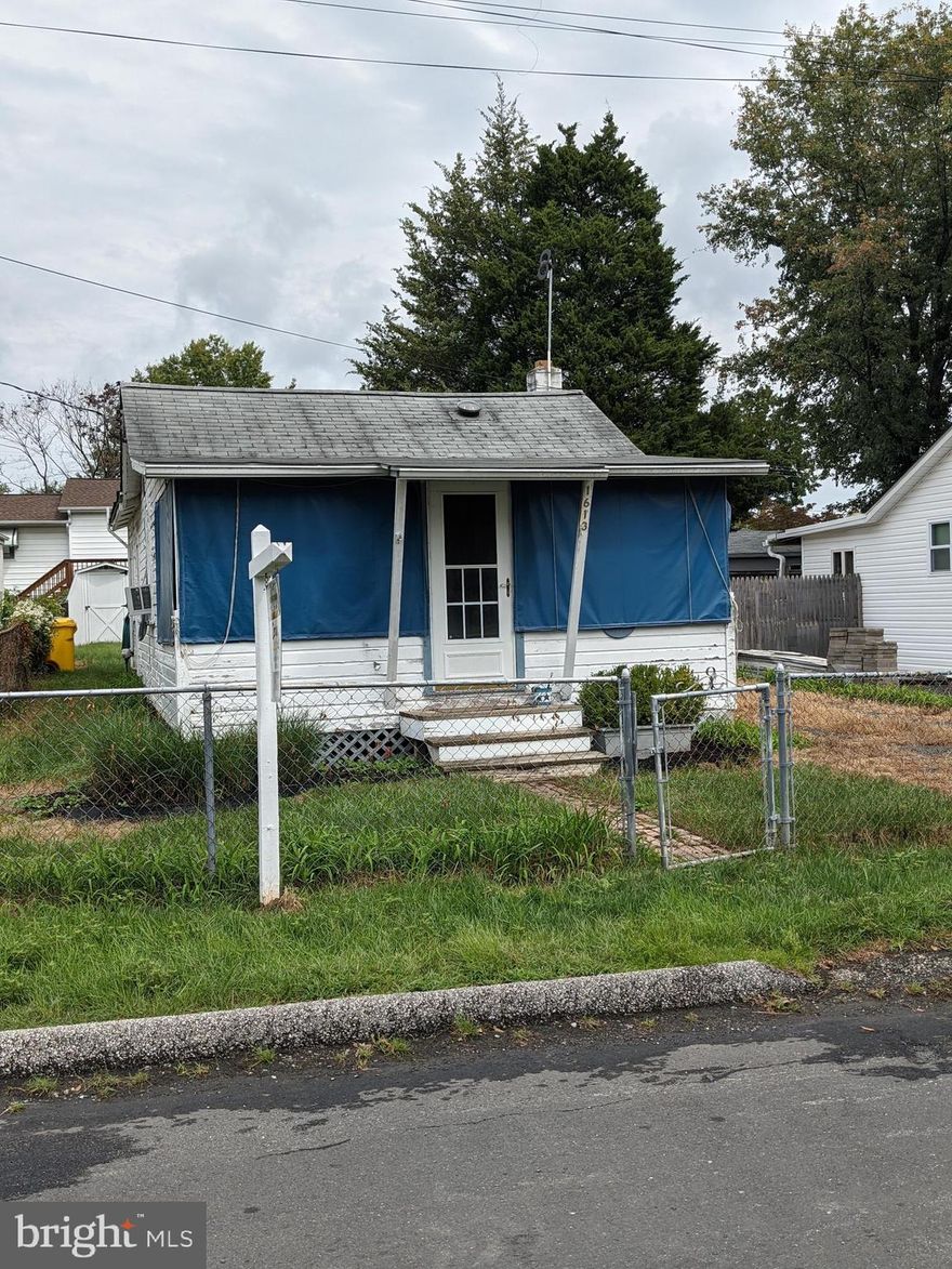 Nice cottage with great beach amenities.  Home has 1 bedroom, 1 bathroom and an office or use as a walk in closet, eat in kitchen and family room.  There is a water softener and a tankless hot water heater  Enjoy your front porch and your nice size back yard with shed.  Walking distance to the playground, fishing pier, boat ramp and beach.  Property is sold AS IS.