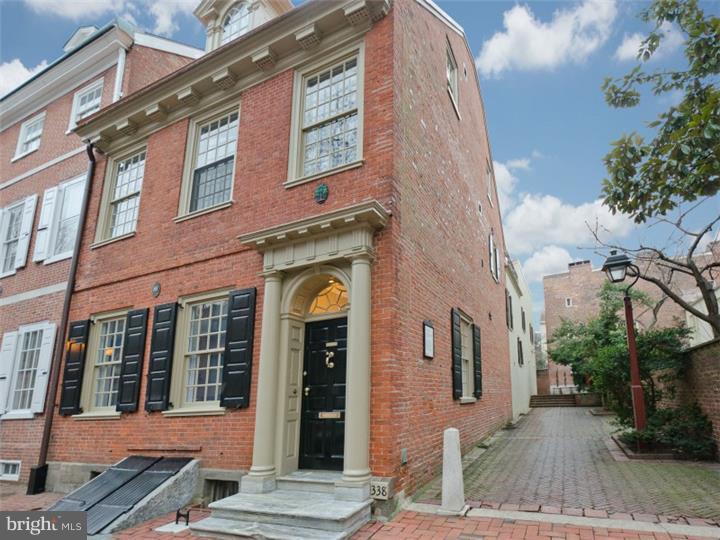 The perfect balance of old & new, this historical Society Hill townhouse combines the best of family living with gracious entertaining. Built in 1771 by and for Thomas Nevel, the master carpenter commissioned to build Independence Hall & Carpenters Hall, this property maintains much of its original character through thoughtful restoration. The elegant entertaining begins upon entrance to the house with a 35 ft deep living area featuring 2 wood burning fireplaces, high ceilings, original wide plank pine floors, and exquisite woodwork flanked by 2 sets of double doors. The gourmet kitchen, designed by Ahn & Robinson, is as stylish as it is functional, featuring custom wood cabinetry, hammered black granite counter tops, limestone tile flooring, built-in Sub-Zero refrigerator, 5 burner commercial stove top, Electrolux double wall oven, and built-in Viking wine cooler. The kitchen is complete with a built-in banquette and a family lounge and overlooks the private courtyard with fire-pit. There is also a conveniently located powder room located on this level. The master bedroom suite on the 2nd level was brilliantly renovated by the principal designer at Ahn-Robinson Studios to create a spa-like urban oasis. Features include 2 custom walk-in closets, a solid Ipe vanity with vessel sink, and a glass enclosed wet room with an oversized soaking tub & tiled shower. The second floor also houses a spacious & light filled family room with a wood burning fireplace, and a guest bedroom with en-suite bathroom. The 3rd floor has two additional bedrooms, a 3 piece glass tiled bathroom, and access to a serene roof deck. Additionally, this property includes a full sized passenger elevator, a full basement with a playroom, 3 storage rooms and laundry room, and has 4 HVAC zones. 338 S. 4th Street is in the heart of Society Hill across from Three Bears Park, and immediately adjacent to Lawrence Court.