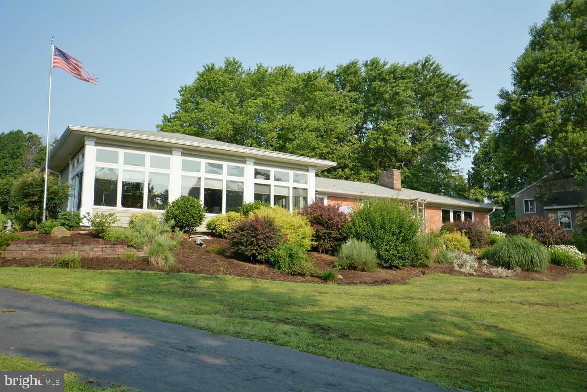 Private, pastoral setting.Home enlarged, updated, & opened..3 car gar./ apt above in industrial-chic design (864 sf) 1/2 ba in garage.Huge master suite with FP.Great room w/ 12' ceiling & loads of glass.Large ofc/exercise room on 1st floor.Large kitchen w/superb storage & island.SGD to deck.Lush gardens. Mini-vineyard. Seasonal Bay views! Rain barrels for H2O conservation.