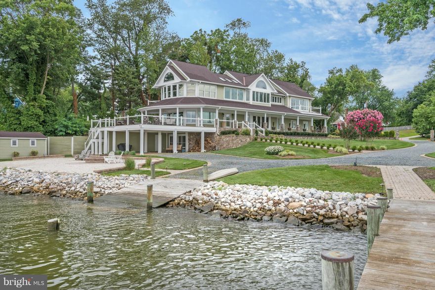 Spectacular waterfront views & sunsets over the South River in Wild Rose Shores community. This private waterfront residence features gourmet kitchen with top-line appliances including Le Cornue range/oven, spa like master-suite, sun-bathed views, 3 large private epay wood piers (1 is 2-tier) w/ water & electricity, boat ramp, azek deck w/ cable railings, 203' of water frontage. 2 lots.