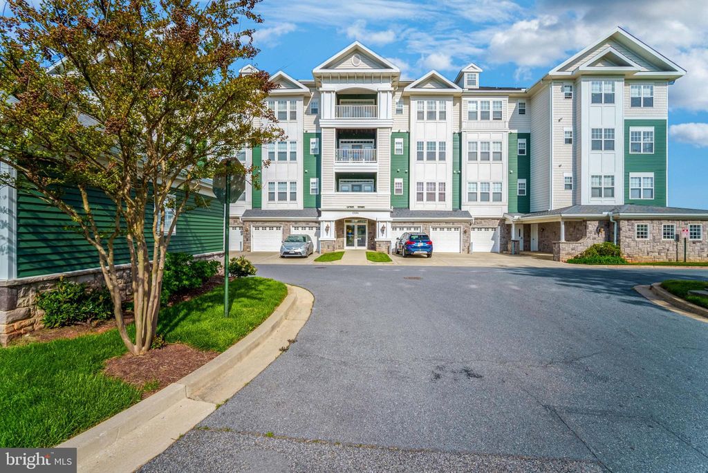 Photo of 13501 Belle Chasse Blvd #215, LAUREL, MD 20707 (MLS # MDPG2181148)
