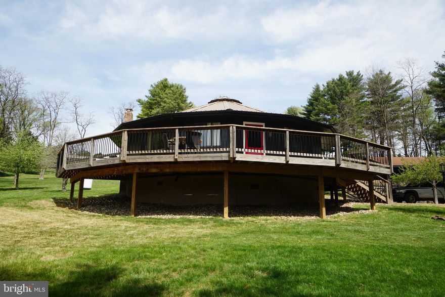 Find your peace and tranquility on this 3.77 acres, surrounded by gorgeous mountain views and an additional lot of 3.29 acres.  This Pentadecagon home is both unique and beautiful.  Private well and private septic exists on the 3.77 acres.  There are 2 outbuildings, a wood shed and a carport.  This home has a new metal roof installed in 2018, deck and bathroom upgrades in 2023.