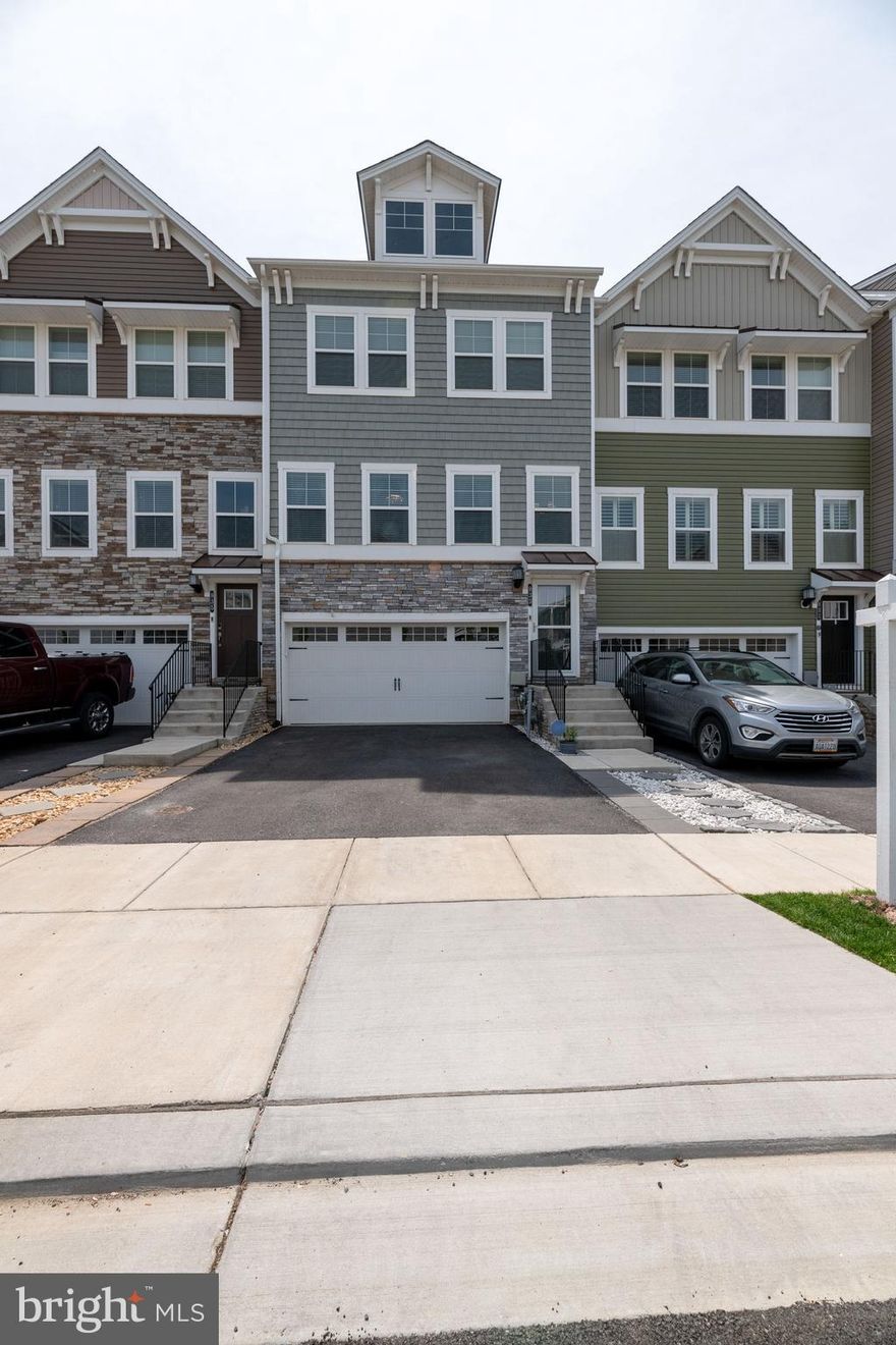 This is an exquisite, model-like home located in the sought after, water accessible community of Tanyard Cove. This 3 level townhome features 3 bedrooms, 2 full baths, and 2 half baths, a finished walkout basement with patio and a deck off the main level.  The interior is full of beautiful features including an upgraded, open kitchen with a 15 ft island, stainless steel appliances, granite counters, a pantry, pendant and recessed lights, a built in wine bar and tray ceiling in the master bedroom.  This home is fully electronic with a Ring door bell and keypad on front door, making it accessible via mobile phone. There are several dedicated circuits, including one in the pantry, allowing for the placement of a deep freezer. Tanyard Cove offers may resort-style amenities including outdoor pool, boat marina, pier, clubhouse, party room,  fitness center, outdoor grilling area, jog/walk path, dog park, pavilion with fire pit, kayak launch, tot lots and biking areas.  **Please note-total sq. ft is 2624 and is all above ground**