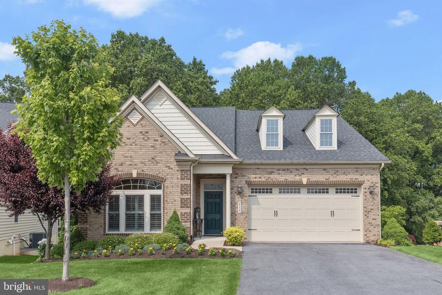 One of the finest lots backing to woods in the popular Waverly Woods West 55+ age restricted community! 
Welcome to this highly upgraded NV Armistead model on one of the BEST lots in Waverly Woods West!  Enjoy this tranquil setting from the rear screened porch with skylights and low maintenance composite deck, or from the lovely stone paver patio on the lower level.  Optional extensions make this the largest Armistead floorplan.   This pristine home has been meticulously maintained by the original owners with upgrades galore throughout!   Interior spaces are beautifully appointed with a gourmet kitchen with a 5 burner cooktop, oversized island, SS appliances, granite countertops and extended cabinetry including wine storage and  an under counter beverage refrigerator.  An open concept living area features oversized windows, a fireplace  flanked by built in shelving, hardwood flooring and custom coffered ceilings.   A main level study with transom topped French door entry features a wall of built in cabinetry.  The primary bedroom suite features a luxury bath with dual sinks, custom tile shower with dual shower heads and a large walk in closet.  A generously sized second bedroom is located on the main level.  The lower level features a daylight rear exposure with a large rec room, bedroom and full bath.   So many upgrades including custom plantation shutters, landscape lighting, inground irrigation, extensive professional landscaping, generator and more!  Enjoy easy living in this popular community offering hiking trails, community clubhouse with fitness room,  pool and more!