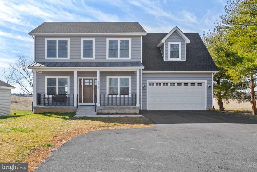 NOT IN AN HOA! BRING YOUR CHICKENS! Better than new 4 bedroom, 2.5 bath home with minimal restrictions. Look forward to waking up every morning to enjoy your coffee and take in the gorgeous pasture views right from your dining room table. The kitchen is sure to impress with granite counters, deep inset sink, soft close oversized cabinets and drawers, stainless steel appliances, and expansive kitchen island with breakfast bar. The adjoining dining room is just off the large deck for gatherings galore. Main level laundry room includes granite counterspace with sink. Primary bedroom with sitting area, impressive en suite primary bath, and walk-in closet. Beautiful, engineered wood flooring along with black fixtures and hardware throughout adds a touch of modern sophistication.  Partially furnished makes your move in practically turnkey. Walk-up basement with rough-in. Versatile outbuilding with electric could be used as a workshop, office, studio and more. High speed internet available!