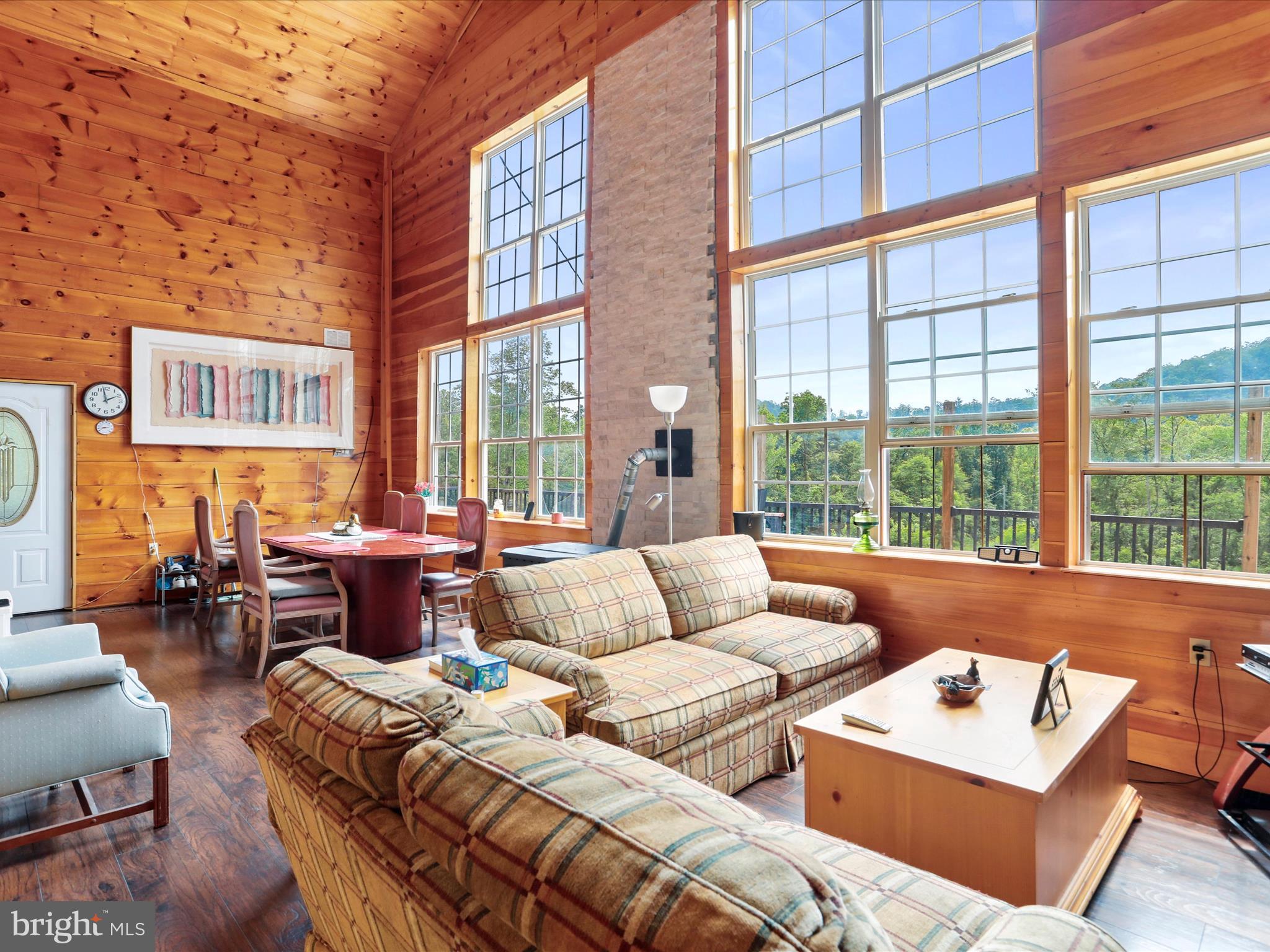 Welcome to 8864 Magnolia Rd, a stunning lodge nestled in the heart of Great Cacapon, WV. This unique property offers the perfect opportunity for a thriving airBnB business or a private retreat for you and your loved ones. With two separate units featuring a total of 5 and 3 bedrooms, there is ample space for guests to relax and unwind. Situated on 10 acres of undeveloped land, this property offers access to the Potomac River, making it a haven for outdoor enthusiasts seeking hunting, fishing, and other recreational activities.
While the lodge is not quite finished, the potential is clear as day. The unfinished state allows for the buyer to put their personal touch on the property and truly make it their own. Currently, there are a variety of tools, building supplies, and furnishings on-site that can be included or removed at the buyer's discretion. New Metal Siding on exterior has 100 year warranty.
With no homeowner's association to restrict your creativity, the possibilities for this property are endless. Whether you choose to complete the lodge and create a one-of-a-kind vacation destination or simply enjoy the tranquility of the surrounding nature, 8864 Magnolia Rd is truly a diamond in the rough waiting to shine.
Don't miss out on this incredible opportunity to own a piece of paradise in Great Cacapon. Schedule a showing today and unlock the potential of this hidden gem.