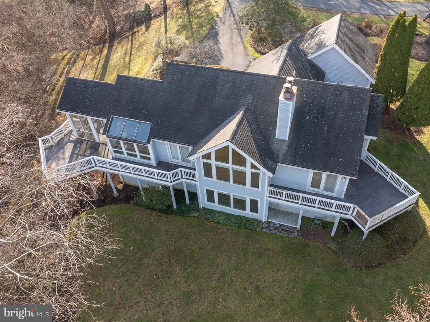 Price Improvement!  Seller says:  Bring an offer for consideration!  Private, upscale living available in the prestigious neighborhood of Cress Creek located in historic Shepherdstown!  This exquisite, contemporary style home was custom-designed and constructed by locally renowned builder, Michael Taylor.  Many attributes lend themselves to this 3,276 square foot home including vaulted ceilings, custom glass windows and skylights, hardwood flooring, custom countertops and fixtures, wine room and wet bar, plus spacious decking which make this the perfect home for entertaining or simple relaxation.   The golf course and its views are at your fingertips!  As you enter the driveway, take notice of the lush landscaping and mature trees specifically appointed by the former owner.  Enter through the ornate front door and your eyes will be drawn to the abundance of natural light that radiates throughout the home and the spacious living room that adjoins the open style kitchen and dining area.  The kitchen allows for plenty of cooking and entertaining space.  Accessible by the kitchen, is the nicely-sized screened porch which connects to the expansive rear decking.  The deck area allows for year round views of the golf course and outdoor dining and cookouts.  Continuing inside the home, the spacious living room features an oversized glass window and a fireplace.  There is also a powder room for convenience.  The primary suite contains a walk-in closet with private bath featuring separate shower and sunken tub plus a double vanity with marble countertop.  Downstairs, you will notice the great room which features a fireplace and wet bar.  The great room allows for access to the rear yard at walkout level.  Additionally, there are two separate bedrooms complete with two full bathrooms perfect for all types of family living or out of town guests.   Rounding out the lower level, is a recreation room, wine room, cedar closet and ample storage space.  All of these wonderful  amenities can be yours plus convenient location to Shepherd University, Bavarian Inn Resort, C&O Canal and Towpath, Potomac River, and downtown Shepherdstown shops and restaurants!