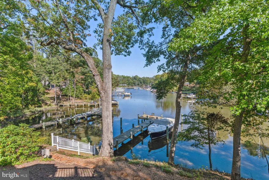 Introducing a coastal gem with artistic touches… Nestled by the waterfront, this property offers a luxurious blend of functional design and artisan craftsmanship. With approximately 2,000 sq. ft. of Timbertek decking, relax on the master bedroom's private balcony with soft down-lighting or lounge on the carefully crafted deck seating under the bow window's gentle glow. Walk along durable brick pathways, set on deep concrete foundations, leading to a driveway masterfully designed by Driveway Impressions of Annapolis. Complementing these is a picturesque stone garden and meticulously crafted stone structures by Earth Design. Inside, the radiant Australian Cypress wood floors set the stage. Hand-painted touches by renowned Annapolis artist, Cindy Fletcher Holden, grace the kitchen and living spaces. The kitchen boasts Corian counters, top-tier appliances, and British hand-painted decorative tiles. All exterior wall-mounted lights and door fixtures are crafted from Baldwin's enduring lifetime brass, a testament to the home's commitment to quality. Add in modern conveniences like a powerful generator, and tech-ready provisions, and this residence is both a haven of luxury and a masterpiece of design. Embrace this harmonious blend of comfort, artistry, and coastal living. The mean low water is over 6 feet at the private dock. Incredible views up Lake Ogleton which leads out to eh Severn River and Chesapeake Bay respectively. Adjacent lot that is an approx 0.47 acre waterfront parcel with public sewer can be purchased separately for $400,000 or can be combined with 1011 Dulaney for $2,950.000. Engineering has not been done but the lot could be a fabulous accessory dwelling unit (ADU) for this property or an opportunity to maintain the privacy you already have. More details available upon request. Don’t miss out!