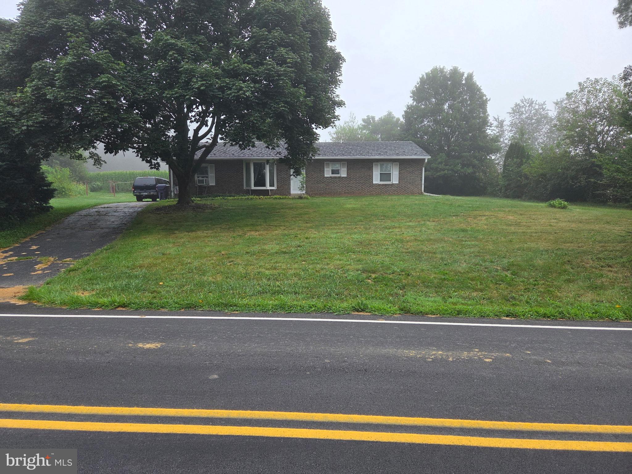 This property will be offered at Public Auction on Tuesday, October 28, 2025 @ 6pm. The listing price is the opening bid only and in no way reflects the final sale price. 10% down due at auction, 2% transfer tax to be paid by the purchaser, real estate taxes prorated. This brick ranch home, set on over half an acre in a peaceful country setting, offers comfort and convenience. The main floor includes a cozy living room, an open kitchen and dining area, three bedrooms, and a full bathroom. A partially finished basement provides additional living space, and the private backyard is ideal for relaxation or entertaining friends and family! The property also offers easy access to local vineyards, farmers markets, and Routes 72, 76, and 283. While in need of cosmetic updating, this property offers great potential!