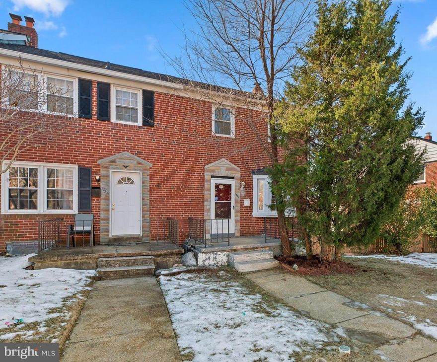 Charming end-of-group townhouse offering 1,228 square feet, 3 bedrooms, and 2 full baths in desirable Ridgeleigh. A welcoming front porch leads into a bright and open main-level living room with bay windows and beautiful flooring that seamlessly flows into the formal dining room. Adjacent is an all-white kitchen featuring ample cabinetry, a gas range, classic white subway tile, and access to a sun-drenched sunroom that opens to a wrap-around deck. Upstairs, three bedrooms provide comfortable retreats, including a primary bedroom. A stylish full bathroom completes the level, offering modern finishes. The finished lower level provides additional living space with recessed lighting, a second full bathroom, and walkout access to a covered patio with storage. The fenced backyard, lined with trees, offers added privacy and a serene outdoor retreat.