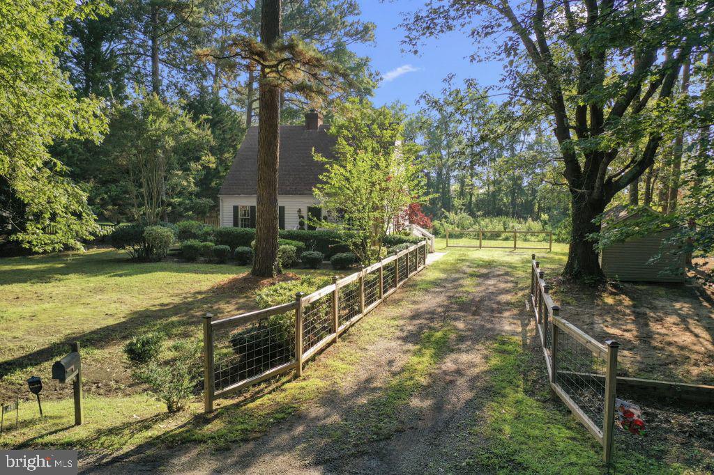 Charming Storybook Cottage in Gwynnfield Waterfront Community. Tucked away at the end of a quiet
cul-de-sac, this picture-perfect 3-bedroom, 2.5-bath cottage offers peace, privacy, and endless charm.
Situated on over half an acre along a serene estuary, you’ll enjoy daily visits from birds, cranes, turtles and
abundant wildlife—a true nature lover’s paradise! Built in 1989 as a replica of a historic saltbox, this home blends timeless character with modern comfort. Features include cedar siding, both front and back brick porches, and two cozy fireplaces—gas in the living room and wood-burning in the dining room. Hop on your bike or golf cart and head to the community’s two beaches, boat ramp, and pier—perfect for
swimming, fishing, or kayaking on the Rappahannock River. A newly added large storage shed offers extra
space for outdoor gear and tools. Conveniently located with an easy commute to Dahlgren Naval Base, Fredericksburg, and Bowling Green, this home offers both relaxation and accessibility. If you’ve been dreaming of a storybook home surrounded by nature with water access and wonderful community amenities, this is a must-see!