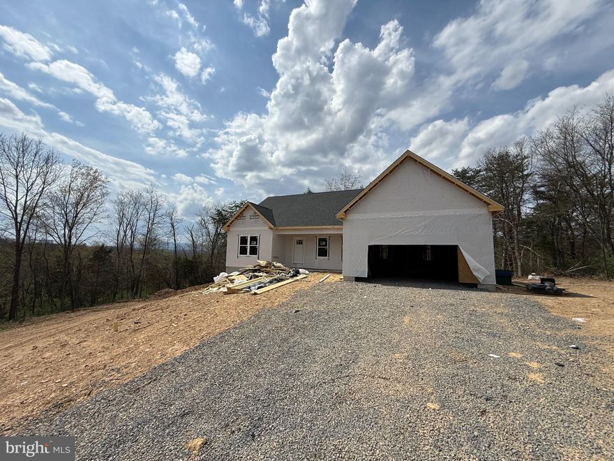 Nice new construction home , under roof . 2± Acres –  3 Bedrooms, 2 Bathrooms, Unfinished Basement.
Discover the charm and convenience of single - level living in this beautifully designed to-be-built ranch-style home, perfectly situated on 2.2±  acres of partly wooded land. Offering the ideal blend of privacy, nature, and modern comfort, this home provides a peaceful setting while maintaining close proximity to everyday amenities. The thoughtful floor plan includes 3 spacious bedrooms and 2 full bathrooms, with an open-concept main living area designed for both functionality and style. Large windows invite natural light throughout, showcasing the scenic wooded backdrop that surrounds the property.
Downstairs, the full unfinished basement offers endless possibilities — featuring a rough-in for future plumbing, it’s ready for your vision- additional living space, a recreation room, home gym, or storage area to suit your needs. Some color selections you are still able to pick from .