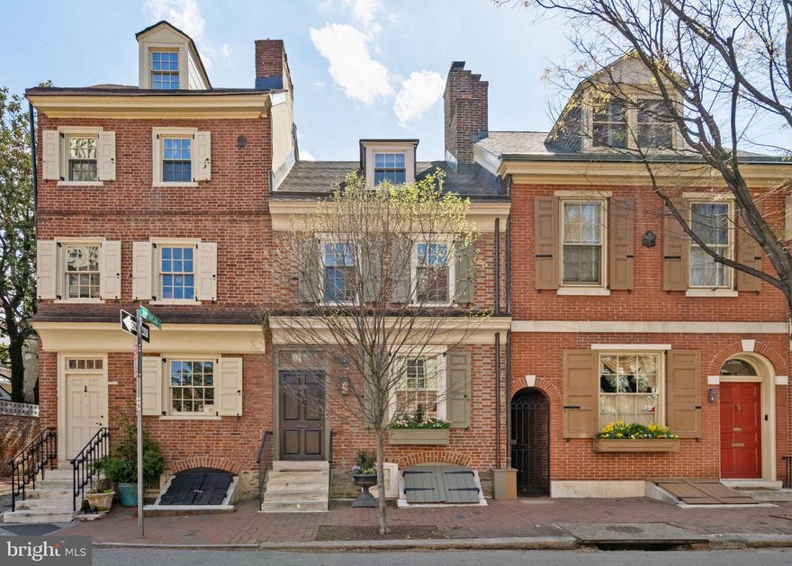 Tucked along one of Society Hill’s most picturesque blocks, 228 Spruce Street blends timeless historic charm with thoughtful modern updates. This beautifully renovated home features 3 bedrooms, 2 full baths, and a powder room, hardwood floors throughout, and a layout that combines elegance and function.

Enter the home through a vestibule with built-in coat storage, then into the living room lined with beautiful custom millwork, a built-in dry bar, and a gas-burning fireplace.

The kitchen has been thoughtfully appointed with an abundance of custom cabinetry, high-end appliances, and a dining nook. French doors lead to the private outdoor patio—perfect for morning coffee or al fresco dining.

A custom turn stair leads to the 2nd level, which offers the primary bedroom with custom closets, an adjacent bathroom with a tub/shower combo, a single vanity sink, and a built-in cabinet. Also on this level is a guest bedroom (currently used as a den) with south-facing windows. The 3rd story offers a bedroom suite with a built-in Murphy bed, providing convenience for guests and serving as a home office during the day. A gas fireplace and en-suite bathroom with a glass-enclosed shower complete this level.

The lower level of this home features a powder room, laundry, and storage.

The current owners made many recent upgrades, including new HVAC, architectural window replacements, lighting, hardwood flooring, patio hardscaping, a new washer & dryer, and the custom Murphy bed.

A rare opportunity to own a classic Philadelphia home that balances history, comfort, and location in one of the city’s most beloved neighborhoods.