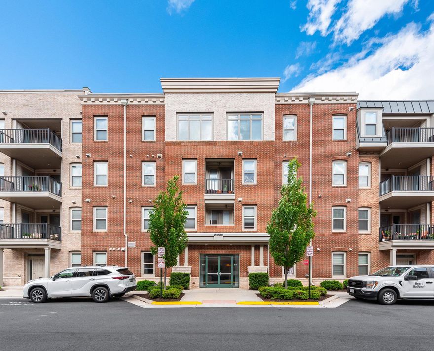 An opportunity to enjoy elevated living in Brambleton’s sought-after active adult Birchwood community. Beautifully appointed throughout, this light-filled condo offers the perfect blend of modern comfort, thoughtful design, and resort-style amenities.

The open-concept layout is designed for both everyday living and effortless entertaining, with a spacious family room flowing seamlessly into the gourmet kitchen. Rich wood flooring, crown molding, and expansive windows create a warm yet sophisticated atmosphere, while the kitchen serves as the heart of the home with upgraded countertops, a large center island with seating, stainless steel appliances, and abundant cabinetry and pantry storage. A private balcony off the main living area extends the living space outdoors and offers the perfect spot for morning coffee or unwinding at the end of the day.

The primary suite offers a peaceful retreat with a spacious walk-in closet and a beautifully finished en suite bath featuring dual vanities and a large walk-in shower. Two additional bedrooms provide flexibility for family members or guests, while a separate cozy nook creates the perfect space for a home office, reading corner, or hobby area. The spacious laundry room adds everyday convenience with additional storage and a linen closet.

Additional highlights include an end-unit attached garage with direct building access located just steps from the front door of the unit, a pet washing station in the main lobby mud room, a convenient trash chute, and access to the penthouse-level lounge - the perfect extension of the home for quiet evenings, gathering with neighbors, or hosting intimate get-togethers (reservations would be required for private events).

Life at Birchwood at Brambleton is centered around connection, wellness, and convenience, with exceptional amenities including indoor and outdoor pools, two state-of-the-art fitness centers, pickleball and bocce courts, walking trails, clubhouse spaces, billiards room, social activities, a gorgeous lake, and more.

Ideally located near everyday conveniences and local favorites including Paris Baguette, Harris Teeter, restaurants, the Brambleton library, movie theater, Dulles International Airport, and major commuter routes, this beautifully maintained home offers more than just ease and convenience - it offers a lifestyle that feels effortless, connected, and wonderfully like home.