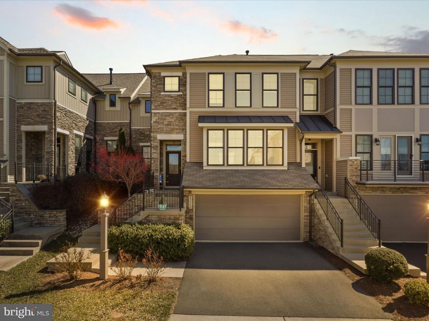 *Promotion* This house potentially comes with a 5.375% fixed rate! This stunning NW-FACING California-style dream home by Miller & Smith is the one you’ve been waiting for! From the moment you step inside, you’ll be captivated by the open-concept design, modern elegance, and high-end finishes throughout. An all-white, ultra-modern kitchen with a massive island, gleaming quartz countertops, and top-of-the-line stainless steel appliances makes this the perfect place to entertain and create culinary masterpieces. Gorgeous hardwood floors flow throughout the main level, featuring a versatile flex space—ideal for a formal living room or office—a separate dining room, and an inviting family room with a striking stone fireplace as the cozy centerpiece.

Escape to the elegant primary suite, complete with a tray ceiling and a spa-inspired bath featuring separate vanities and an oversized, frameless glass-door shower. The spectacular screened porch offers the perfect spot to unwind while overlooking the huge, fenced backyard with serene, private wooded views. The entertainer’s dream basement is complete with a full bath, media space, and easy potential for a fourth bedroom—the possibilities are endless!

Live in amenity-rich Brambleton, named Best in American Living by the National Association of Home Builders. Parks, pools, trails, and more await, all in an unbeatable location with quick access to Rts. 7, 50, 267, the Silver Line Metro, and Dulles International Airport.