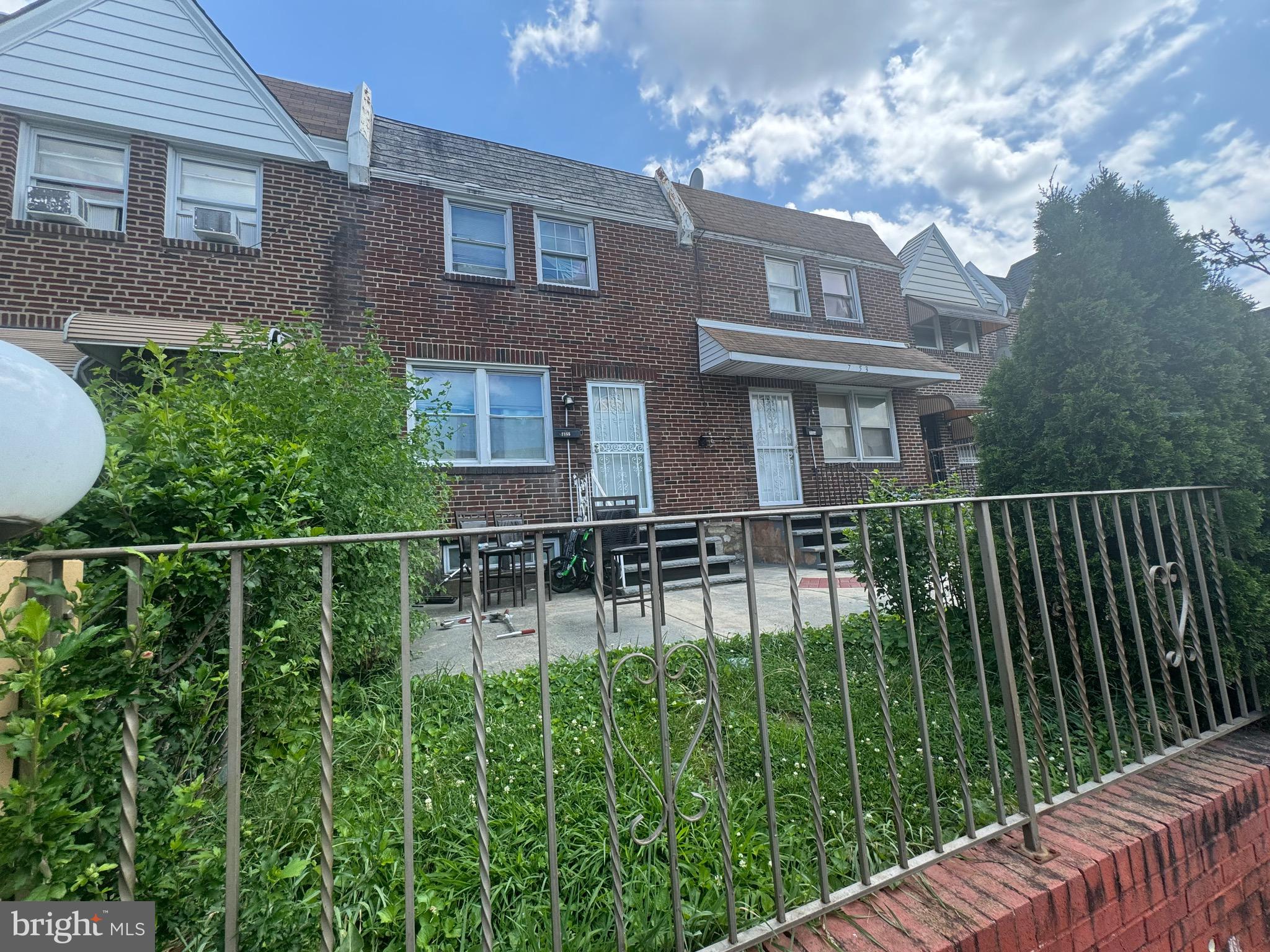Charming row home located in the highly desirable Castor Gardens neighborhood. This classic-style residence features a welcoming front patio, a walkout basement in the rear, and the added convenience of off-street parking. Enjoy excellent walkability, easy access to public transportation, and proximity to major roadways—making commuting a breeze whether by foot, transit, or car. You are nearby supermarkets, local favorites, stores restaurants and more so you can enjoy the neighborhood and experience everything the city of Philadelphia has to offer. Can be sold as a package with home next door (7153). Property is sold as-is and seller will not make any repairs. Seller will provide U&O.