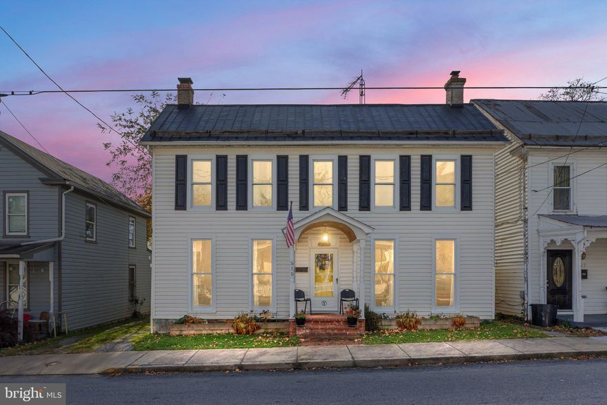 Nestled near the heart of historic downtown Martinsburg, this charming colonial home offers a perfect blend of timeless elegance and modern convenience. Boasting four spacious bedrooms and one and a half baths, this residence is a true gem with original hardwood floors throughout. Step inside to discover a warm and inviting interior. The main floor features a spacious living room, and a cozy family room complete with a pellet stove, and large windows that allow natural light to flood the space. The country kitchen offers the perfect blend of vintage charm and modern functionality, with updated appliances and plenty of counter space. The backyard is a true retreat, offering plenty of space for outdoor living, gardening in the greenhouse, or simply relaxing in the shade of the trees with your favorite beverage. The storage shed is equipped with shelving and electric.  Located close to downtown Martinsburg, you'll have easy access to its charming shops, restaurants, and cultural attractions.  Also located close to commuter routes and the MARC Train.  **Recent improvements: Newer Kitchen appliances and Hot Water Heater (2020), New Pellet Stove (2022), New 275-gallon Oil Tank (2021), New Window A/C Units (2021).  Furnace recently serviced and in great condition (per Roach Oil).