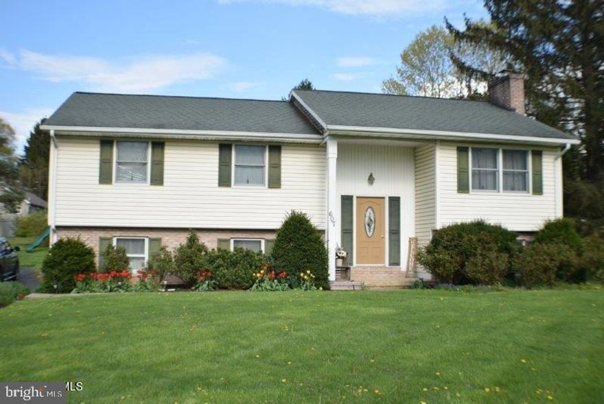 Convenient location on South Main Street with 1,866 square feet of finished living area. Updates include kitchen wall oven, microwave, range, additional cabinetry, and tile flooring. Breakfast bar is an added benefit. The living room has a built-in cherry entertainment center and shelving. Finished lower level with wood burning brick fireplace in the family room, additional bedroom or office, ¾ bath, and laundry. Enjoy the summer evenings entertaining in your spacious sunroom. Home has duct work for central air conditioning. Please note the home is connected to public sewer and has a tank and grinder pump. Home is tenant occupied, a 24-hour showing notice is required.