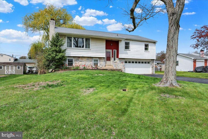 Welcome home to 410 Laurelwood Drive! Located in the desirable Amity Gardens community and the sought-after Daniel Boone School District, this bi-level home offers four bedrooms, one and a half bathrooms, and a two car garage. The beautiful stone front adds to its curb appeal and charm. On the upper level, you’ll be greeted by a spacious living room featuring exposed beams, fresh paint, and a large window that fills the space with natural light. The adjoining dining room boasts hardwood laminate flooring and access to the back deck—perfect for outdoor dining or relaxing. The eat-in kitchen offers plenty of cabinetry and room to make it your own. Three carpeted bedrooms with closets are also located on this floor, along with a shared full bathroom in the hallway. The lower level features the fourth bedroom and a generously sized family room with sliding glass doors that open to the fenced-in backyard. The level yard is ideal for entertaining, pets, or enjoying time outside. Conveniently located near local dining, shopping, and major highways, this home is ready for you to make it your own. Schedule your showing today!