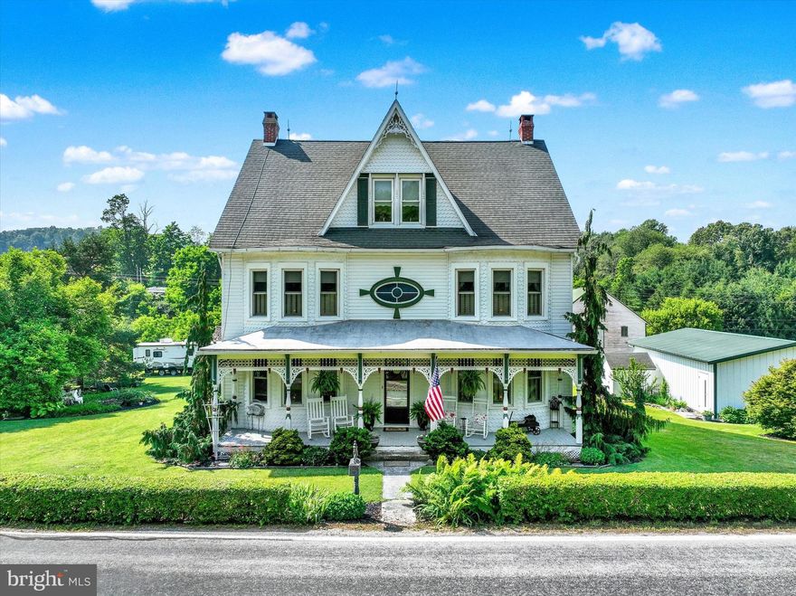 Welcome to a once-in-a-lifetime opportunity—a timeless Victorian estate set among the rolling hills of Codorus Township in scenic Southern York County. This extraordinary 3-story Victorian home, originally built in 1903, was completely restored from the studs up between 2006 and 2007. Nestled on 46 plus, picturesque acres of gently sloping pasture, wooded groves, natural springs, and open fields, this one-of-a-kind property offers a rare blend of historic charm and modern comfort.

From the moment you arrive, the craftsmanship and character of this home shine through. The home features original gingerbread trim, restored fretwork, transom windows, and a stunning oval stained-glass window on the second floor. Enhancing its historic appeal is the newer custom vinyl siding, carefully designed to replicate the home’s original gingerbread detailing, offering the beauty of the past with modern durability.

Inside, the home offers over 4,000 square feet of living space with 9½-foot ceilings on the first two floors, a mix of original and new hardwood flooring, ceramic tile, and plush carpet. Restored original six-panel doors, decorative archways, and intricate woodwork maintain the soul of the home, while updated systems ensure everyday convenience.

The spacious kitchen is thoughtfully designed with custom quartz countertops, imported Italian backsplash tile, a double oven/range, a brand-new 3-rack dishwasher, and a French door refrigerator. Soft-close drawers, ample cabinetry, and a charming walk-in pantry offer function and storage, while the original refinished built-in cabinet and buffet add authenticity. Adjacent to the kitchen, the first-floor laundry/mudroom and a full bathroom add everyday practicality.

The primary suite offers a peaceful retreat, complete with a luxurious clawfoot tub that overlooks the countryside. A walk-in shower with a built-in seat, a custom walk-in closet, complete the en suite bath. On the third floor, a vaulted-ceiling sitting area connects two generously sized bedrooms, creating the perfect space for guests, family, or quiet relaxation. Custom blinds and shutters are thoughtfully installed throughout the home, and new tilt-in replacement windows allow for easy maintenance.

Outdoor living is just as inviting. A new mahogany porch off the kitchen leads to a stamped concrete patio ideal for entertaining. Attached is a unique 3-story “Summer House,” a relaxing cabin-like space with a massive brick fireplace (in need of restoration). Below it, stone-walled rooms with a brick floor and built-in bar offer rustic ambiance and space to unwind. Surrounding the home are mature trees, lush landscaping, and perennial flower gardens that bloom throughout the seasons.

The detached oversized 3-car garage includes water, electric, and finished walls and ceilings, offering additional utility and workspace. A charming smokehouse and two outdoor sheds (one in need of TLC) provide extra storage. The barn, though in disrepair, offers potential for restoration or removal. The 46-acre property includes pastures, hay and crop fields, streams, woods with marketable timber, and two building rights for subdivision or future development.

Modern systems include a brand-new heat pump (2024) servicing the second and third floors for both heating and cooling. The oversized septic system was thoughtfully designed to accommodate large families and social gatherings. The water supply includes a reverse osmosis system and UV light filtration, ensuring clean, safe drinking water year-round.

This remarkable property offers so much more than just a place to live—it offers a lifestyle of beauty, and heritage. Whether you dream of a private retreat, a multi-generational estate, or a place for gatherings and celebrations, this home and land provide the perfect canvas.
Don’t miss your chance to own one of Southern York County’s most enchanting and complete historic estates. 
Owner is PA licensed agent/listing agent.