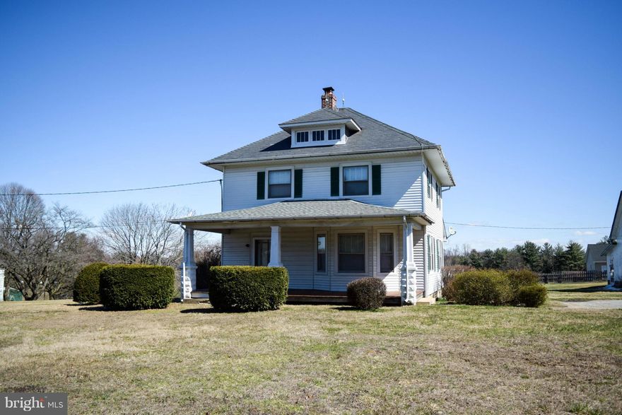 Large, traditional 3 BR, 1.5 BA farmhouse w/ big front porch on nice level 1 ac. lot has original hardwood floors & beautiful exposed trim, wood FP in Living Rm, formal Dining Rm, big detached garage & lots of old-fashioned charm. Walk-up attic can easily be finished for additional living space. Zoned village residential & conveniently located, creating many possibilities. Great opportunity!