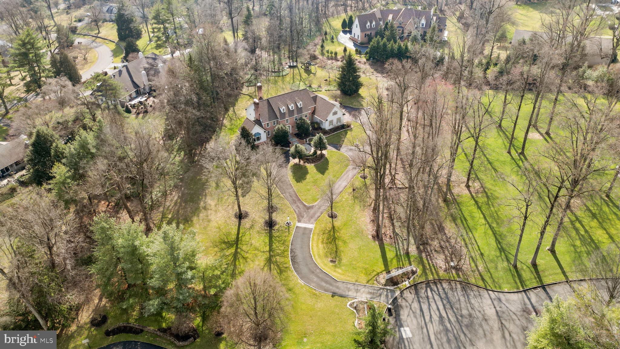 Incredible custom built home perfectly positioned on 2.64 acres with mature trees and gorgeous landscape on a quaint cul-de-sac. Previously owned by an award winning builder and an interior designer this home was built with top of the line materials with attention to detail being a top priority.
Majestic colonial boasting stunning brick and cedar exterior, this home radiates charm and elegance with modern amenities throughout! Enter into the 2 story dramatic foyer featuring marble floors with turned staircase and custom trim moldings flanked by a formal living and dining room. The outstanding open floor plan allows you to appreciate the hardwood floors throughout and soaring ceilings! Four fabulous fireplaces will create the right amount of ambience and warmth, and if the power should fail, the partial house generator is ready on demand! Stately office with cherry built-ins perfect for working from home. These areas will surely become some of your favorite spaces in this home, but maybe not as much as the amazing gourmet kitchen that is found adjacent to the 2 story great room highlighted by coffered ceiling. It truly has it all–an abundance of gorgeous wood cabinetry, Corian & wood countertops, a massive center island with a prep-sink and seating, double wall ovens, butlers pantry, Sub-Zero refrigerator, a full pantry , an eat-in breakfast area with sliders to flagstone patio, kitchen also leads to the screened in porch area with cathedral ceilings and brick flooring. Also, there is a second staircase leading to a fabulous second-floor. This floor also boasts half bathroom, laundry room and mud area with access to 4 car garage with EV charger!
You will in awe of the layout of the 2nd floor. Featuring 5 large bedrooms, 3 with en suite bathrooms and 2 with shared attached bathroom. The primary bedroom area is a retreat in and of itself. It features a fireplace, a large walk-in closet, and a gorgeous en suite bathroom with oversized stall shower, Jacuzzi tub, double sink vanity and water closet. Your own personal oasis!
The fully finished basement just extenuates all the grandeur this home has to offer. Movie theater, bedroom, bathroom and 2 additional rooms to use as you wish. What more can you ask for in a home? Make your appointment today to tour this spectacular home as this is one that you must see to truly appreciate all that it has to offer.
