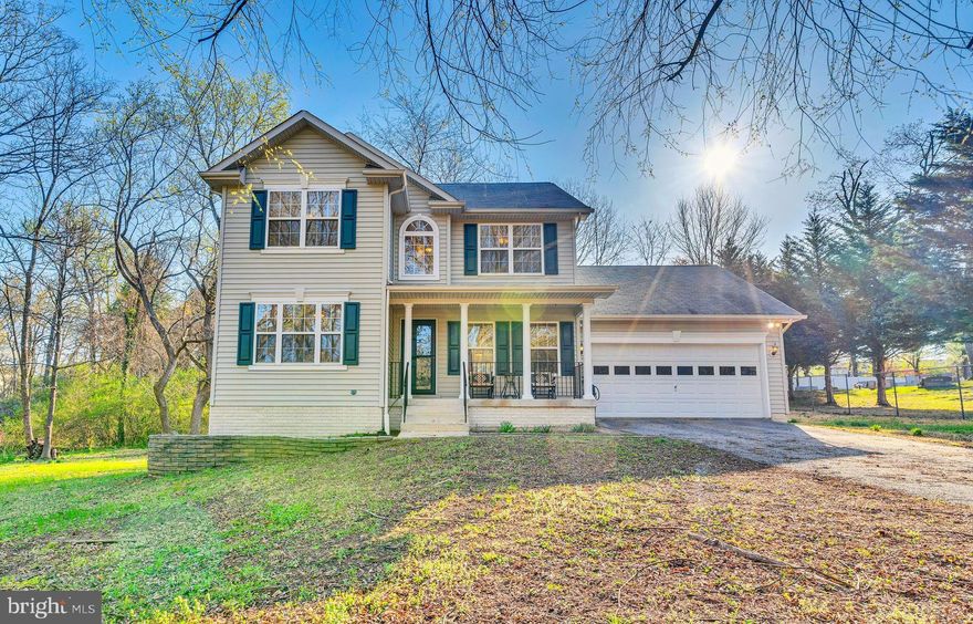 Nestled on over an acre of land, this charming Colonial offers comfort, space, and thoughtful features perfect for easy living. Freshly painted with brand-new carpets, the home features an inviting open floor plan, a cozy family room with a ceiling fan, and a bright kitchen with oak cabinets, a breakfast bar, and a bay window nook with built-in storage. The spacious owner’s suite boasts a ceiling fan, oversized walk-in closet, dual vanities, a soaking tub, and a step-in shower. The fully finished basement includes a large recreation room with a wet bar, pool table, propane fireplace, and an additional bedroom—ideal for an in-law suite. The two-car garage is designed for convenience with an automatic opener, pull-down attic stairs, and a unique hoist system for safe and easy storage. Enjoy peaceful views from the covered front porch or relax on the back deck overlooking the wooded backyard. With dual-zone heating, an 80-gallon water heater, and room for a future pool, this home is built for both comfort and entertainment.