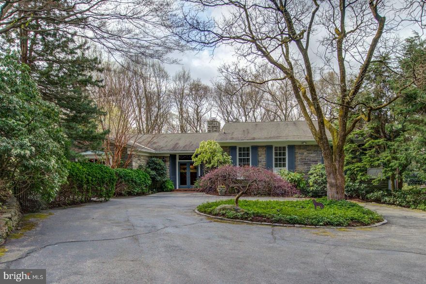 Tucked away on one of the most beautiful, private and secluded streets in Chestnut Hill sits this impeccably maintained custom contemporary home. Nestled against Fairmount Park, the only sounds you hear while enjoying the outside terraces and pool are the sweet songs of the local birds and the distant rush of the Wissahickon Creek in the valley below. The long driveway through mature trees leads to the front entrance of this well-cared for home. Walk through the double doors to the gracious foyer and step down into the expansive living room with wood-burning fireplace, boasting tons of natural light through the wall of French doors that lead to the slate terrace. An adjoining office offers a huge bay window, custom lighting, vaulted ceiling and large, wood-burning fireplace. Watch the birds flutter about the yard from the gourmet kitchen with a fabulous picture window, granite countertops and large center island with Bosch induction cooktop. The adjacent dining room features a large bay window showcasing the grounds. The "upper" level of this home features an expansive master suite with wall of closets, full bath with double vanities, walk-in shower and Jacuzzi tub and a peaceful, private balcony overlooking the yard and the park. A large, custom walk-in closet with walls of custom shelving completes the exquisite suite. A second full bedroom with ample closets and a full hall bath round out this level. On the lower level is the additional bedroom, an office and full hall bath with huge walk-in shower, which also serves as a cabana bath for the pool. The multiple terraces and in-ground pool with gazebo are perfect places to entertain guests, or just to simply relax and watch the nature all around you. Conveniently located just a few minutes from local trains, and the shops and dining of Chestnut Hill. Enjoy your own private oasis!