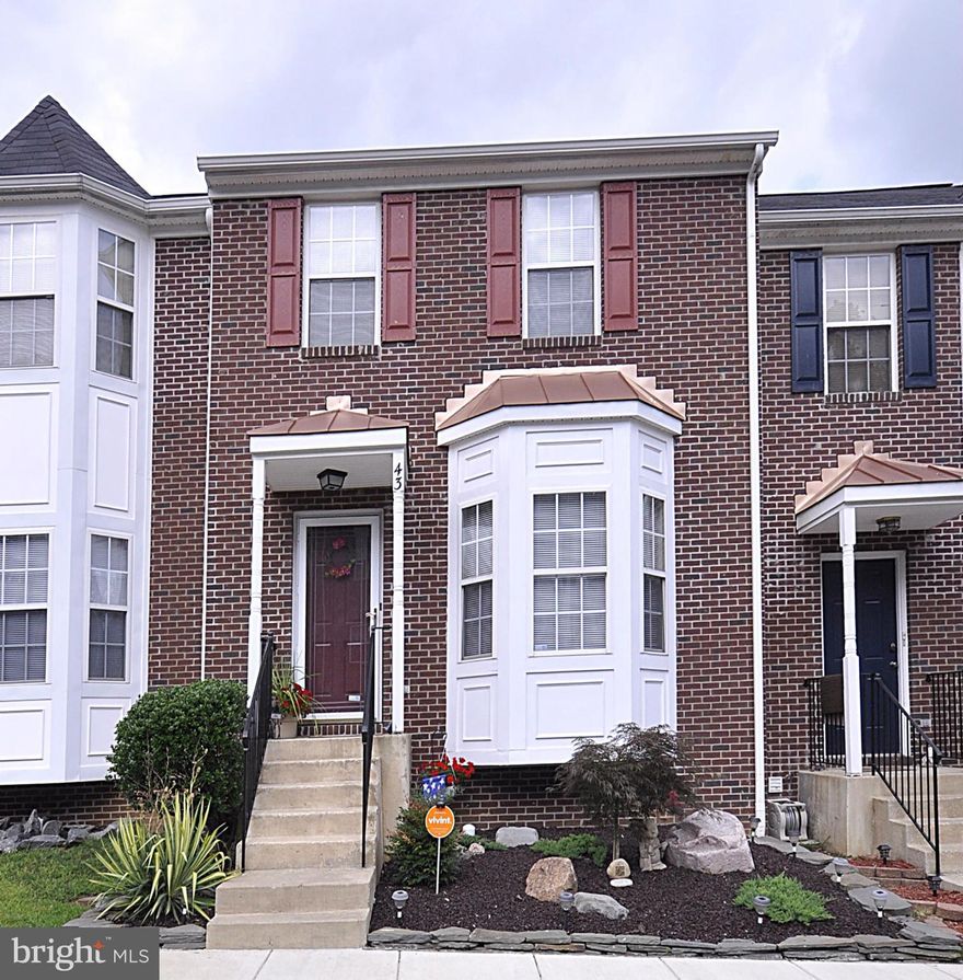 This gorgeous townhome with three finished levels offering numerous upgrades throughout including hardwood and tile floors, large spacious kitchen w/ beautiful cabinetry, formal living and dining rooms, family room w/ fireplace, three full baths, extra room in the  basement, walk out basement to patio and landscaped rear fenced yard.  Curb appeal second to none. A must see!