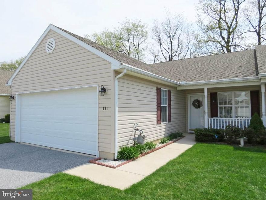 Perfect Move in Condition 2BR 2FB w/open fl plan & neutral decor*C-fr porch*LR w/gas FP*Kit w/appls, brfst bar w/stools*FR opens to rear patio w/auto awning, looks out over farm land*LDR w/washer & dryer*Home is wired for sec*2car garage*Lg Clubhouse w/lots of activities incl pool, walking trails, &  pond*Lawn & Snow by HOA*Over 55 Comm-one of best of the best!