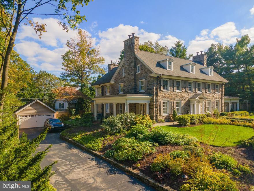 Move right into this completely renovated Main Line Center Hall Colonial just blocks from the wonderful shopping and restaurants of Suburban Square in Ardmore. No detail was overlooked in this magnificent, "down to the studs" renovation, creating a home perfect for all the needs of today's discerning buyer while maintaining the exquisite original details of the home, including arched doorways, crown molding, a striking center stair, deep windowsills, 3 fireplaces and walnut hardwood floors. Upon entering the oversized center hall you are immediately struck by the lovely finishes. To the right, the large living room with marble fireplace and original built-ins will become a favorite place to entertain, and leads to the great room, with french doors to the rear flagstone patio. To the left, framed by pocket doors, the formal dining room with fireplace has doors to the covered porch and butlers pantry with quartz countertops, beverage fridge and ice machine. Side mudroom entrance with custom cubbies, rear stairs, as well as doors to the covered side porch. The gourmet, eat-in kitchen is a chefs delight with large center island, all new Thermador appliances, quartz countertops, custom cabinetry and separate breakfast room with exposed stone, custom built-ins and sliders to the back patio. Upstairs, the private owners suite with fireplace offers a large en suite bath with radiant floors, walk-in shower and double vanity, custom makeup station, large dressing room/walk-in closet and separate cedar closet. Two additional spacious bedrooms that share a new full hall bath, as well as convenient second floor laundry room complete this floor. The third floor offers three additional bedrooms and a renovated marble full hall bath with walk-in shower. The backyard is an absolute oasis from it all, with multiple flagstone patios with fountain surrounded by mature plantings. All this and a detached 2-car garage, all new systems, all new electrical and lighting, new stacks and much more. Just steps from the regional rail train station for an easy commute into Center City Philadelphia, or Amtrak to New York, as well as the trendy shops and dining of Suburban Square and Lancaster Avenue. Award-winning Lower Merion Schools.