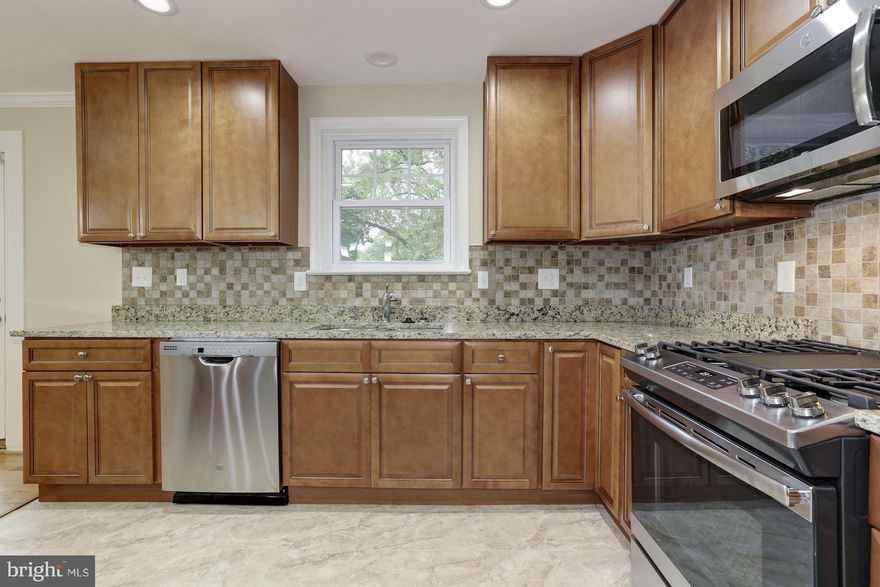 Renovated 4Bedroom/3bath Rambler with Beautiful Large Backyard, Patio & Deck.Renovated with New Roof,Redesigned Kitchen, New Bathrooms,Hardwood Floor, New Electrical Panel.New HVAC, New Hot-water Heater. Kitchen with Cinnamon Glazed Cabinets and stainless steel appliances.Fully Finished Basement with Family Room, Bedroom and Bathroom! Carport with new concrete driveway.Quick Response.Agent Owned