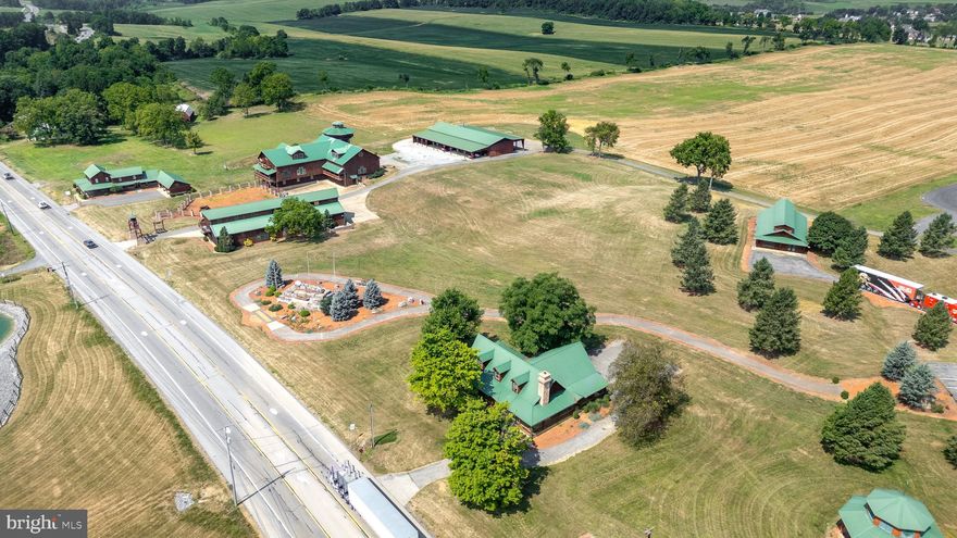 This incredible property offers diverse business, commercial, and industrial opportunities. Spread over 44.36 acres on 4 parcels with an impressive amount of road frontage on Route 322, this location is a true powerhouse for visibility and growth. For over 25 years, this location has been home to a successful business and iconic showroom. The 11,000-square-foot state-of-the-art showroom features a loft area, multiple offices, storage spaces and reception area. Just beyond that is 16,000 square feet of service bays, support areas, inventory storage, and loading docks. This setup is ideal for large-scale business operations. In addition, there are multiple residential income-producing units, a massive event barn, fully equipped, painting and mechanic shops, as well as a primary residence, multiple garages and additional outbuildings. Whether to expand on the existing infrastructure, create a new complex, or develop a multi-use hub, the possibilities are endless. This is more than just real estate—it’s an opportunity for innovation, expansion, and investment in one of the most strategic locations in Pennsylvania. With its unique zoning classification, this property allows for many principal and conditional uses. This property occupies a prime logistical location at the heart of Pennsylvania, with direct connections from Route 322 to Interstates 80 and 99—key arteries for coast-to-coast and regional trade. Its central position in the state places it at the nexus of rail lines and roadways, perfectly suited for distribution, logistics, or national operations. Close to University Park Airport and the Harrisburg International Airport, and within a few hours’ drive to other major airports such as Philadelphia, Newark, JFK and Baltimore, to name a few.

This listing is being sold individually or as a package with PACE2516896. 
For the combined offering see PACE2516292.