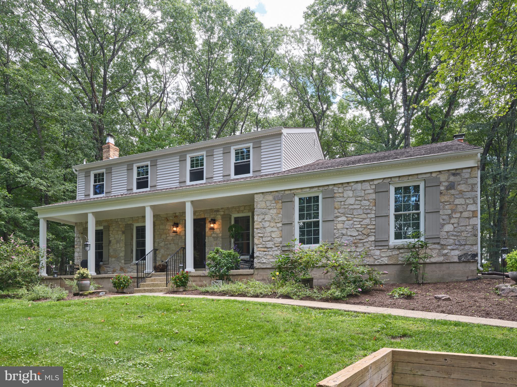 Perched atop a hill along one of Solebury’s most desirable roads, this recently renovated Colonial blends timeless charm with modern comfort in the sought-after New Hope-Solebury School District. The bright and airy modern kitchen, outfitted with premium Wolf and Sub-Zero appliances, sets the tone for gatherings and entertaining, while the adjoining family and living rooms—each with its own wood-burning fireplace—create warm, inviting spaces to relax. With 4 spacious bedrooms and 2.5 bathrooms, the home offers thoughtful design throughout. The primary suite features a private en-suite bath, and the additional bedrooms provide flexibility for guests or home offices. Upstairs laundry adds ease to everyday living. Set on 1.63 landscaped acres, the property offers both open lawn and wooded areas, with garden views providing a serene backdrop. An attached garage and ample driveway parking ensure convenience, while nearby parks, trails, and village amenities enrich the lifestyle. This home combines location, comfort, and style—perfect for making lasting memories.