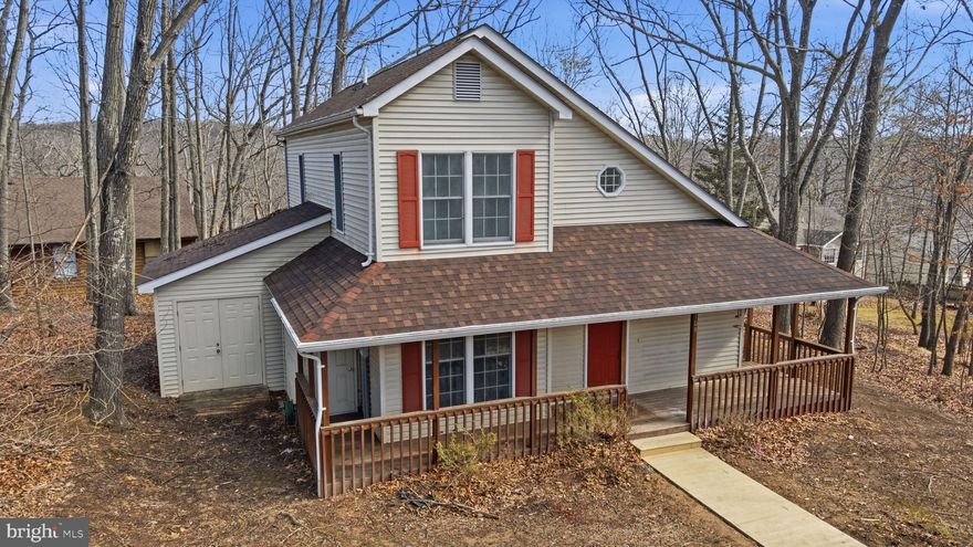 Chalet-Style Retreat in Gated Lake Holiday – Vaulted Ceilings + Wooded Privacy

Welcome to 109 Hilltop Court, a beautifully updated chalet-style retreat nestled in the highly sought-after, gated community of Lake Holiday in Cross Junction, Virginia. Surrounded by serene wooded privacy, this charming home offers the perfect blend of modern comfort, natural beauty, and resort-style living.

Step inside to discover 1,601 square feet of thoughtfully designed living space, highlighted by soaring vaulted ceilings and abundant natural light. Fresh paint, new carpet, and luxury vinyl plank flooring create a warm and inviting atmosphere, while recessed lighting and ceiling fans enhance comfort throughout. Elegant ceramic tile adds a refined touch to select areas.

The updated kitchen features upgraded countertops, stainless steel appliances, a self-cleaning oven, and a built-in microwave—perfect for both everyday living and entertaining. The home offers three spacious bedrooms, including a convenient entry-level bedroom ideal for guests, a home office, or flexible living. The bathrooms have been tastefully updated with new vanities and fixtures and include a relaxing soaking tub and a tub-shower combination.

Situated on a 0.30-acre lot, the property provides ample outdoor space for gardening, entertaining, or simply enjoying the peaceful surroundings. A private driveway ensures convenient parking for residents and guests.

Beyond the home, enjoy the unparalleled amenities of Lake Holiday. Residents have exclusive access to a stunning 240-acre private lake featuring high-speed boating areas and tranquil no-wake zones for kayaking, paddleboarding, swimming, and fishing. Community amenities include sandy beaches with volleyball courts, a marina with 92 slips, a fishing pier, picnic areas, hiking and biking trails, tennis and basketball courts, playgrounds, and a clubhouse with a fitness center and event space. The newly developed Country Club Park offers a 9-hole disc golf course, bocce ball courts, horseshoe pits, and future plans for a dog park and athletic field.

Ideally located just minutes from Winchester and within commuting distance of Northern Virginia, this home provides a peaceful retreat without sacrificing convenience. Shopping, dining, and everyday amenities are just a short drive away.

This is more than a home—it’s a lifestyle. Schedule your private tour today and experience the best of Lake Holiday living.