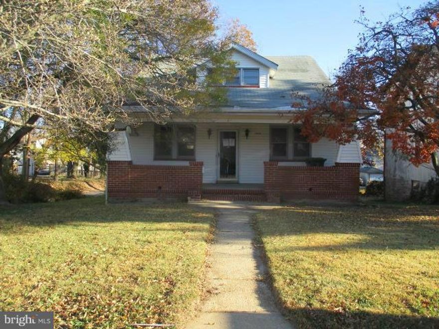 Huge Cape Cod offers 4 bedrooms and 1.1 baths. Some hardwood floors through out. Fireplace in living room & formal dining room. Deck off kitchen. 2 Main level bedrooms & 2 upper. Full basement that has been improved in the past w/ lots of storage and 1/2 bath. Walk out level to nice size rear yard. Garage in rear under deck.Covered front & rear porches. Agents view doc's .Investors dec 21