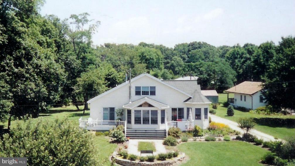 The main residence, a Jerry Coleman product constructed in 2000, features main level master suite w/luxury master bath, Florida room off of the living room, spacious kitchen with breakfast nook, separate dining room and full basement. The lush landscape consists of fig trees and persimmon, grape arbor, and more! Separately deeded cottage w/ 2 bed, 1 bath included!...chestertownhomeandcottage
