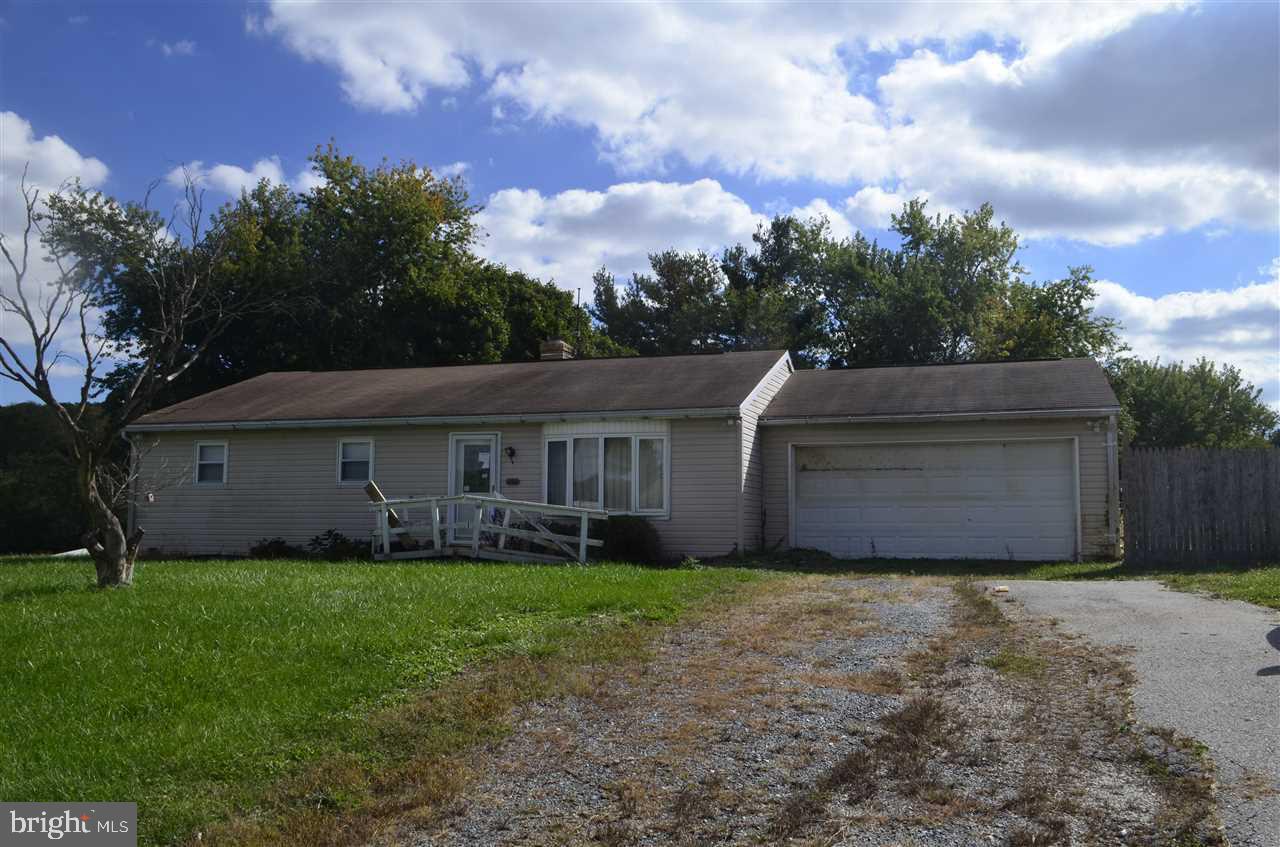 1 story ranch home on 4 acres. Sold in "as-is" condition. Home needs work and updates but has loads of potential and a great country location. Per Township, the refrigeration outbuilding will have to be removed