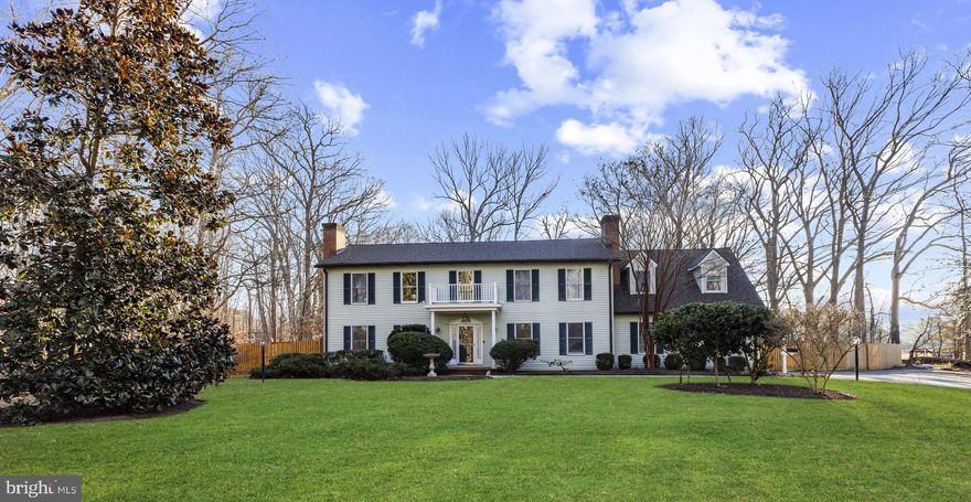 Nestled in the prestigious Bennett Point community, “Deerwood” is a stunning Colonial offering over 3,200 sq. ft. of thoughtfully designed living space on a picturesque 5-acre lot. Blending elegance with everyday comfort, this home is ideal for relaxed living and entertaining alike.
The interior features a gourmet kitchen with abundant storage, two ovens, and a sunlit casual dining area that flows seamlessly into the main living spaces. Three wood-burning fireplaces and a gas wood stove, living and dining rooms, and a library/office provide both charm and functionality. A bright sunroom overlooks the custom freeform pool, patios, and tranquil wooded surroundings.

The generous floor plan includes four bedrooms, highlighted by a luxurious primary suite with fireplace, heated-floor bath, walk-in shower, soaking tub, large walk-in closet and even a laundry chute!  A versatile bonus/flex room with an alternate separate entrance offers options for a home gym, office, nursery, or creative space. HVAC updated in 2022, roof in 2024, upgraded well pump in 2024, freshly painted and new carpet 2026.

Step outside to your private retreat, surrounded by mature trees and lush landscaping. Enjoy entertaining on multiple patios, relaxing by the pool, or quiet moments by the waterfall and pond. Additional features include a new wooden fence, whole-house generator, security system, laundry chute, extra storage, and a separate mudroom with garage access.

This exceptional property combines space, privacy, and sophistication—creating a true sanctuary to call home with easy access to dining, shopping, Route 50, Kent Island and Easton.  Don't wait to make this house your home!!